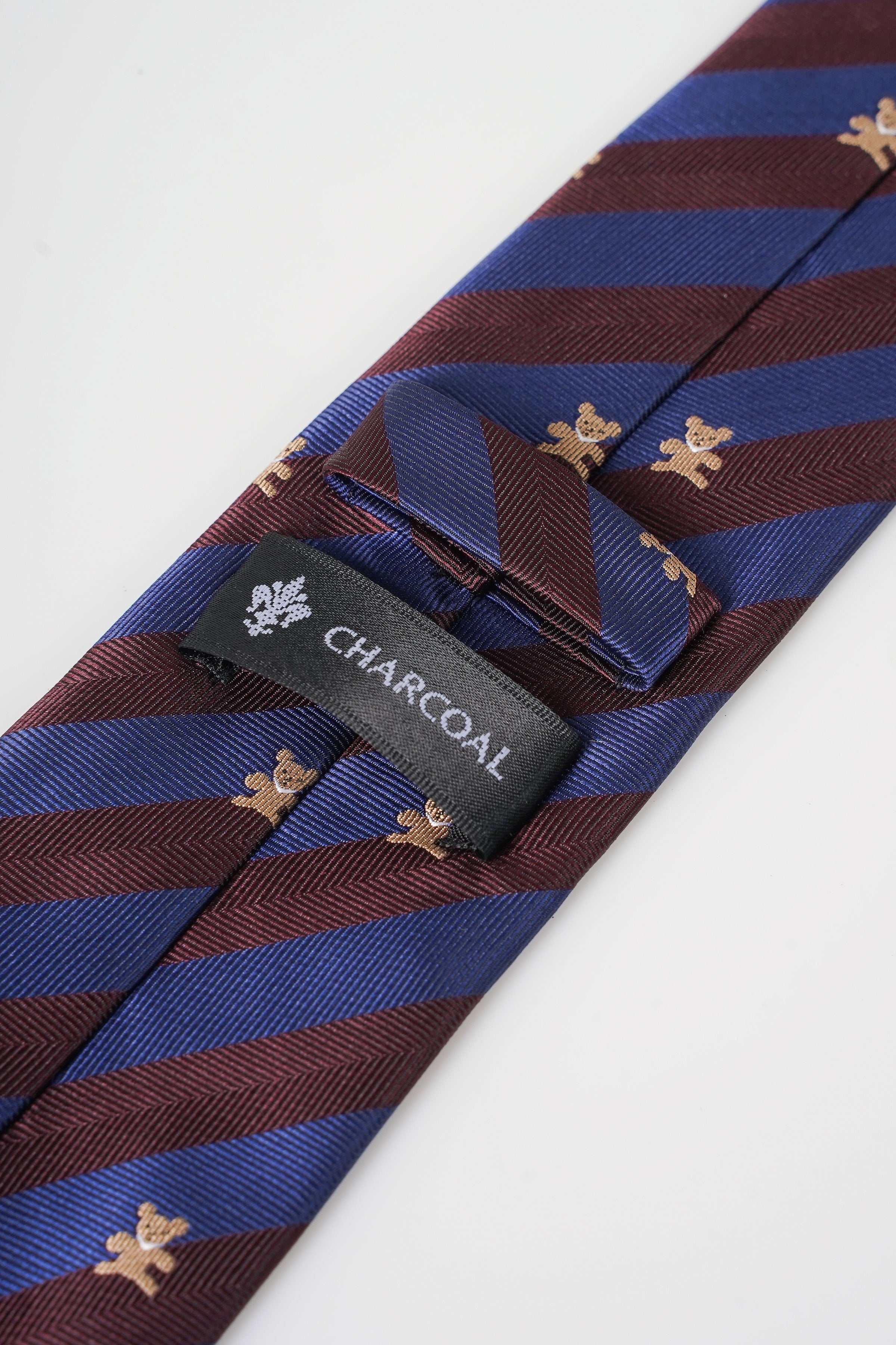 Striped poly silk necktie with fleur-de-lis motifs, logo label detail