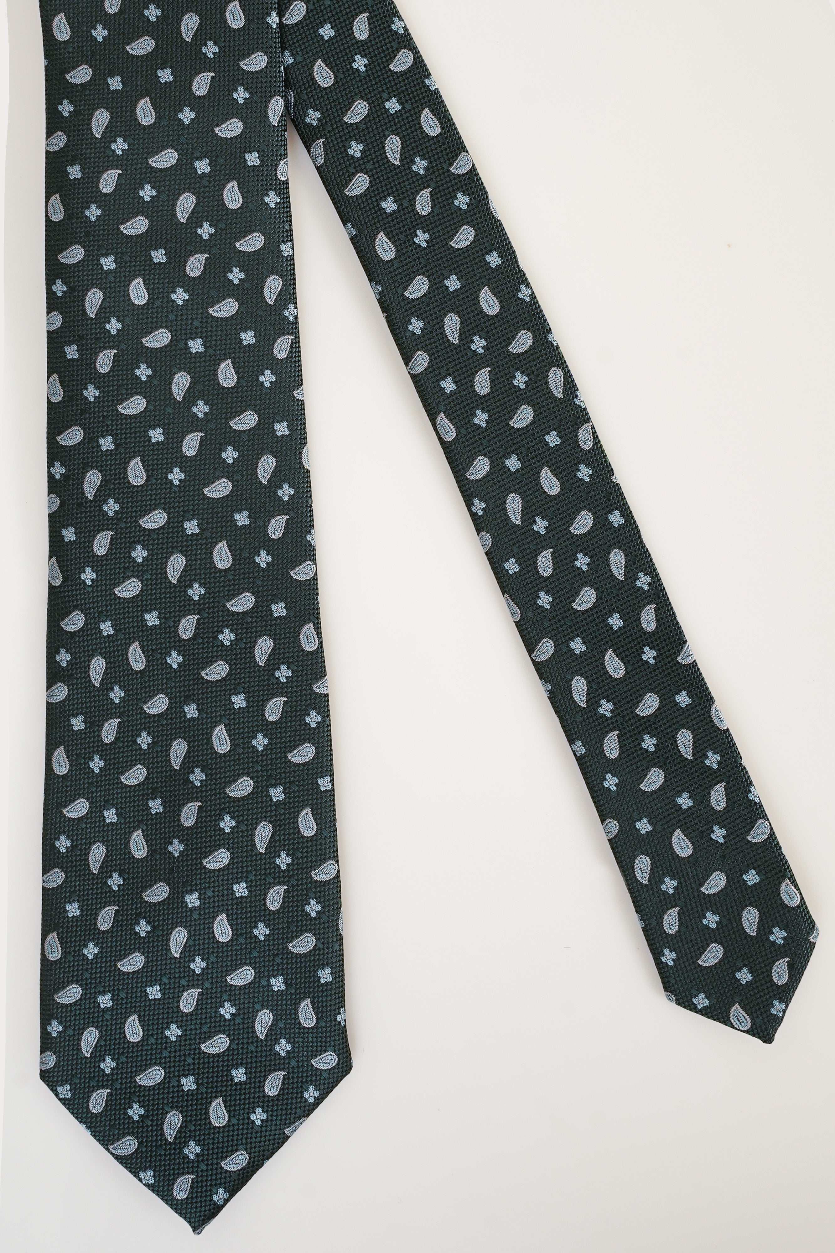 Poly silk tie, dark teal with small white paisley pattern.