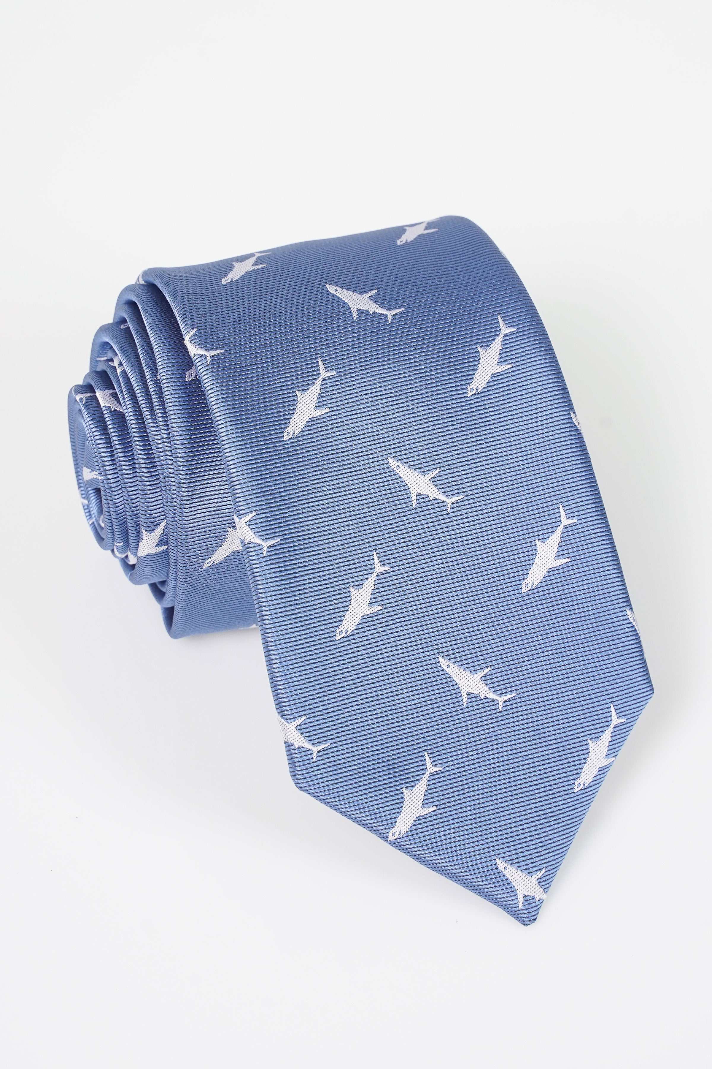Blue patterned necktie with white bird motifs and textured sheen