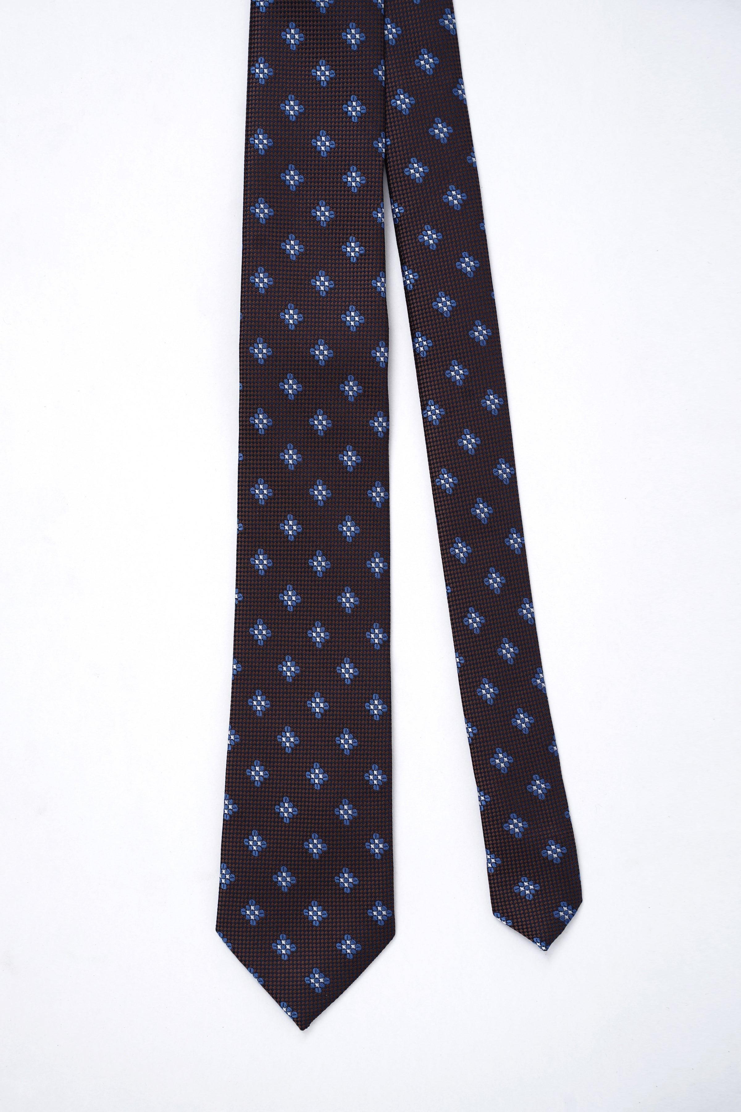 Dark brown necktie with full-length repeating blue quatrefoil pattern.