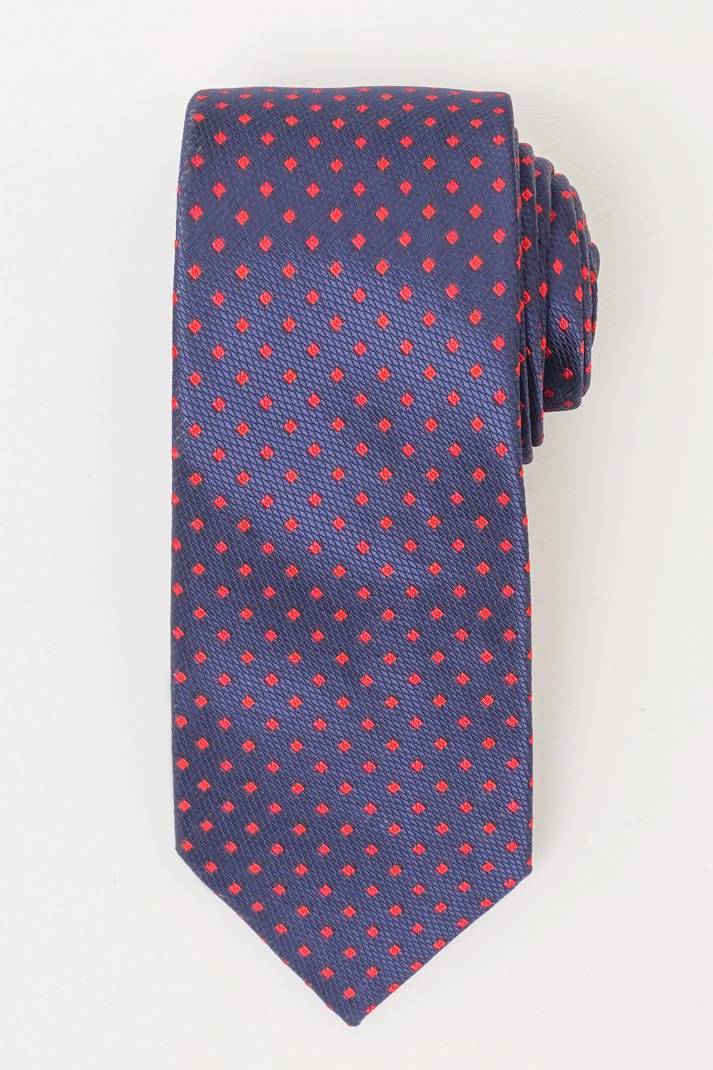 Navy poly silk tie with red and blue micro-dot pattern, pointed tip