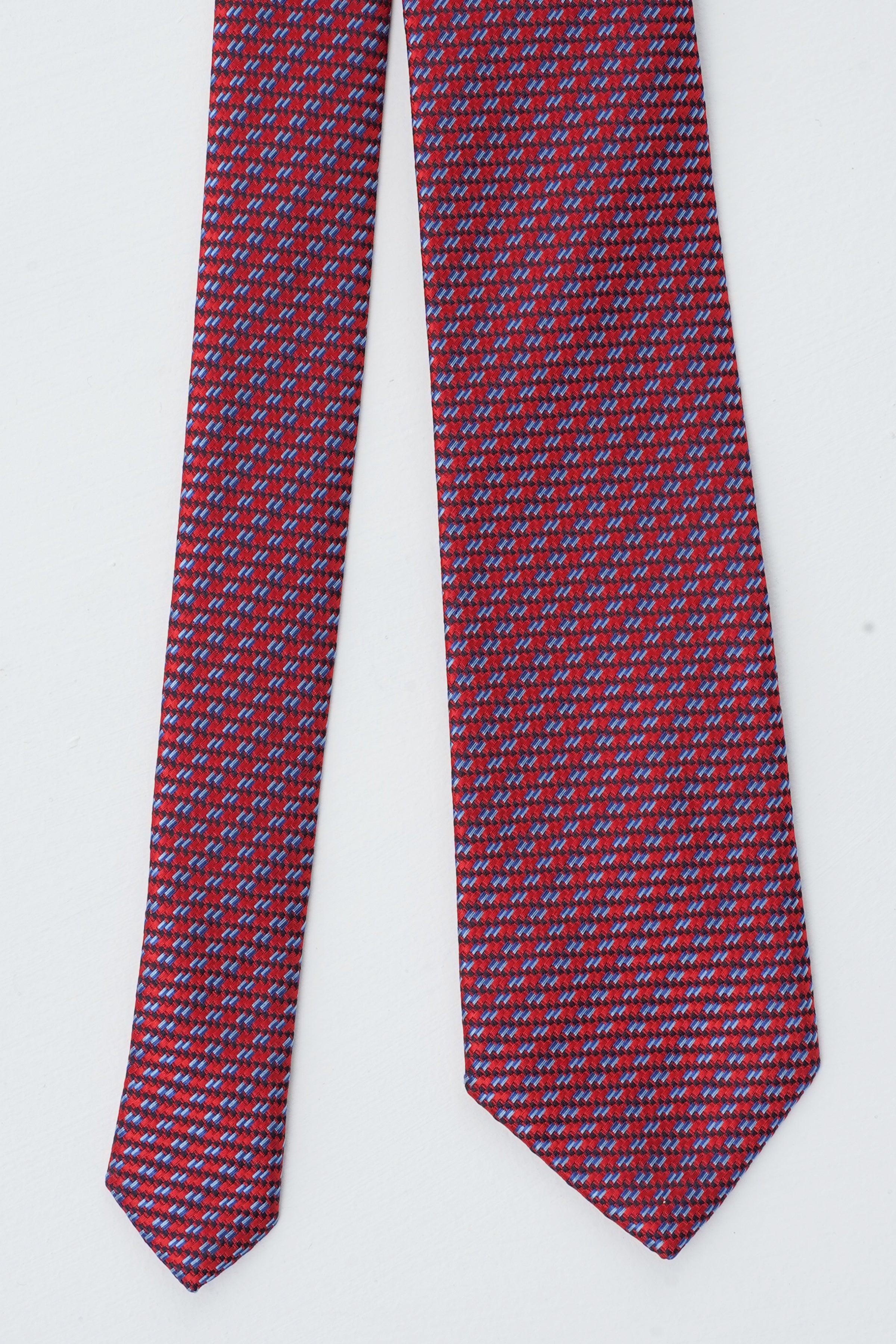 Poly silk tie, flat view, dark red and blue micro-pattern with pointed blade tip