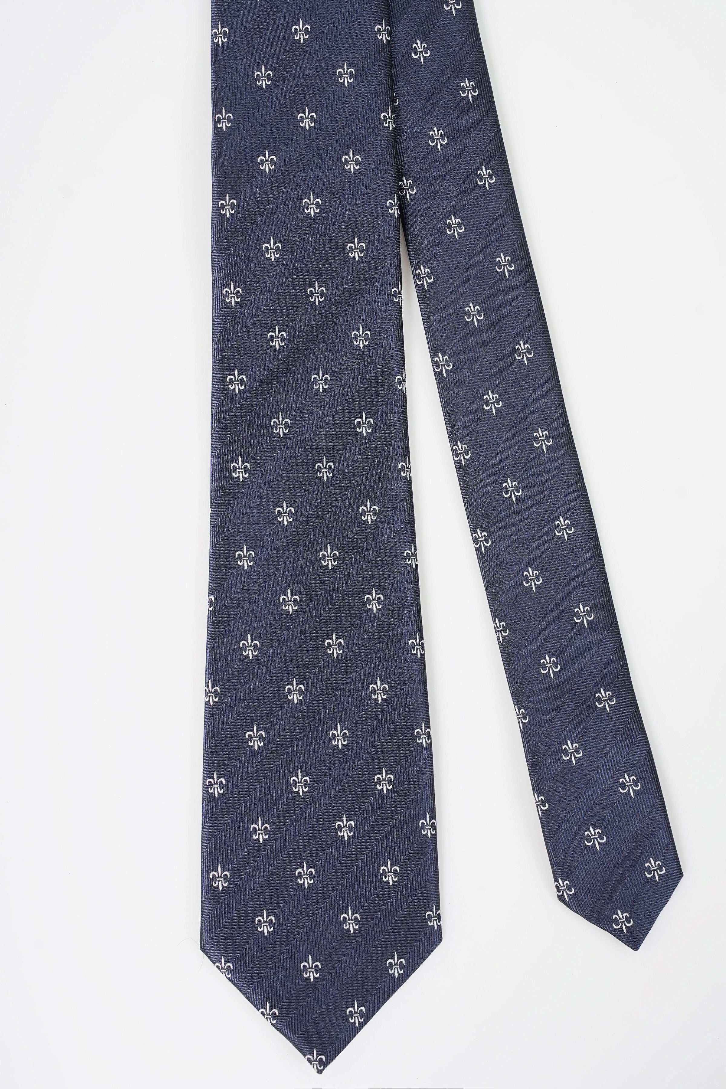Dark navy tie with repeating fleur-de-lis pattern, straight hanging