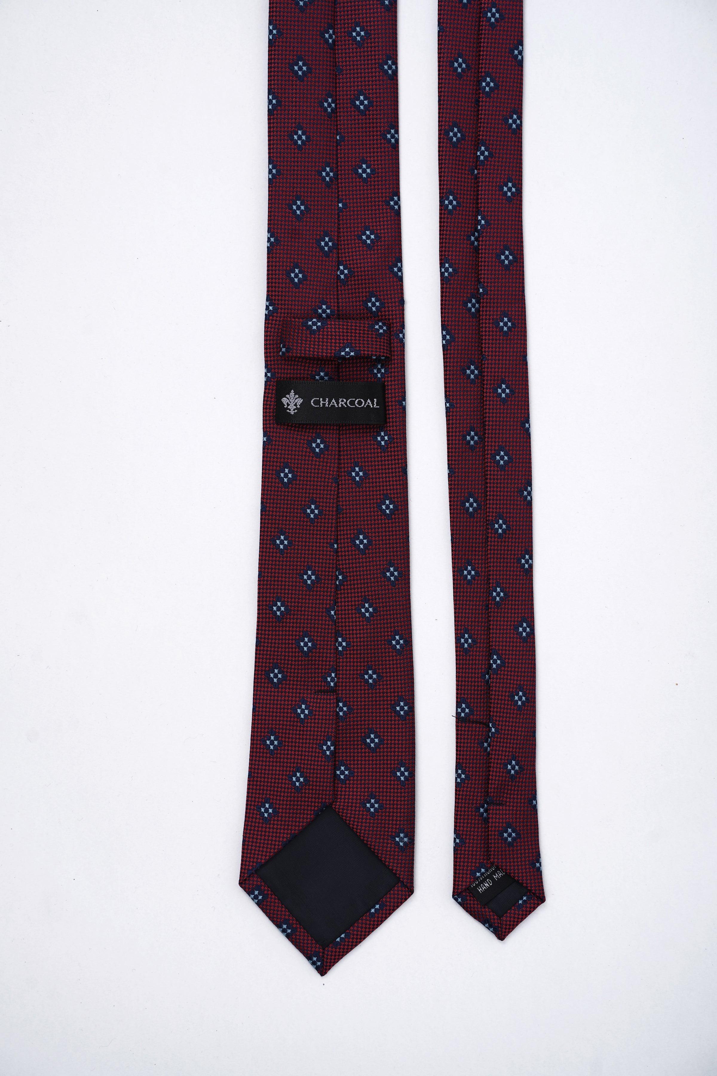 Poly silk tie with patterned ends; burgundy and navy geometric print