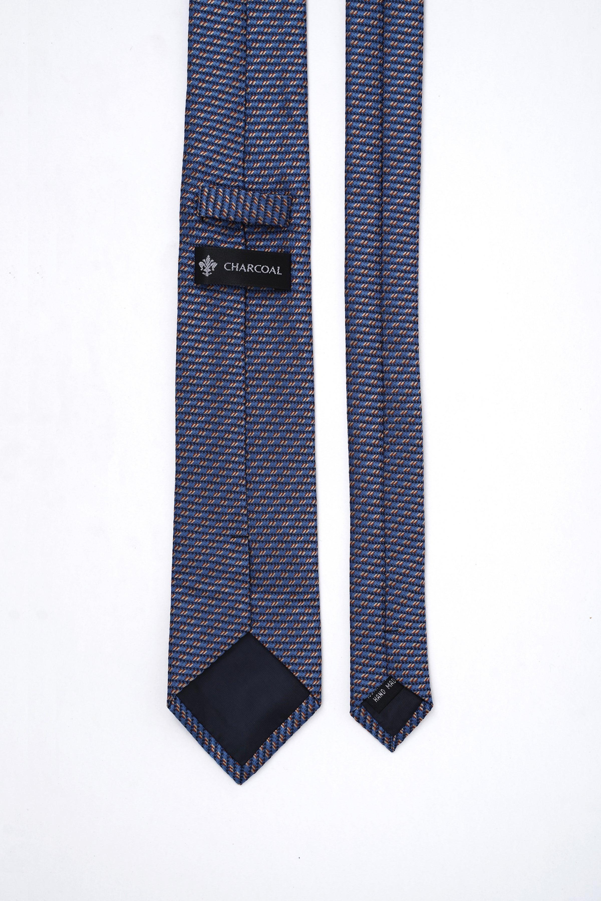 Poly silk tie detail with CHARCOAL label and navy orange micro-pattern