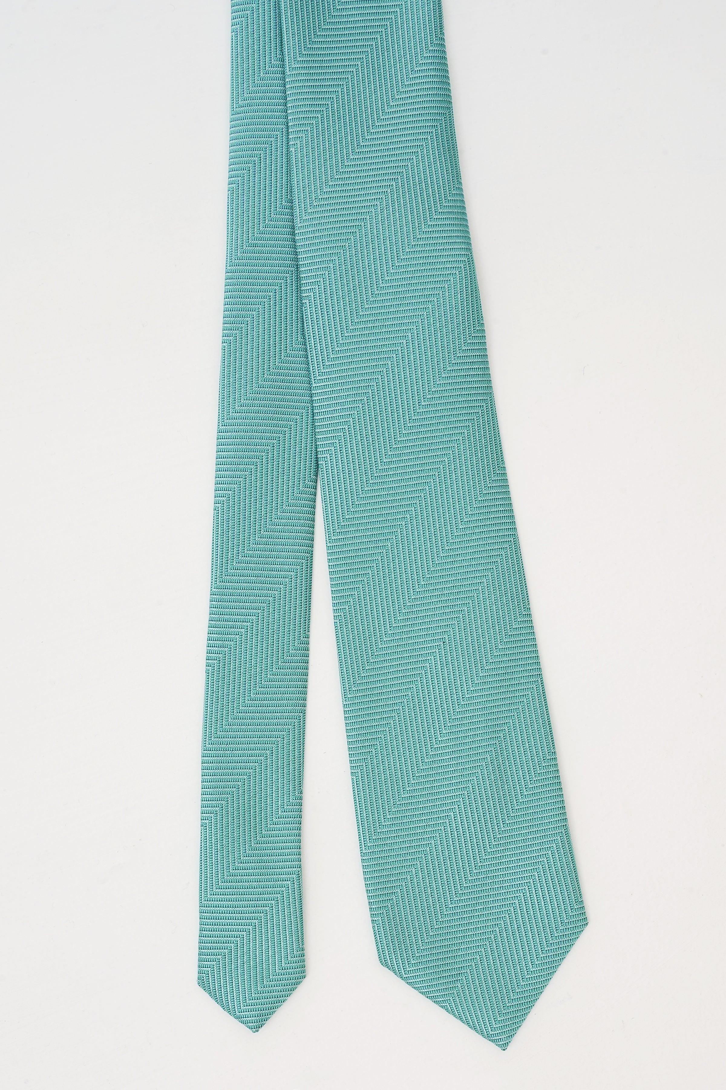 Turquoise poly silk tie with textured chevron weave pattern, narrow ends