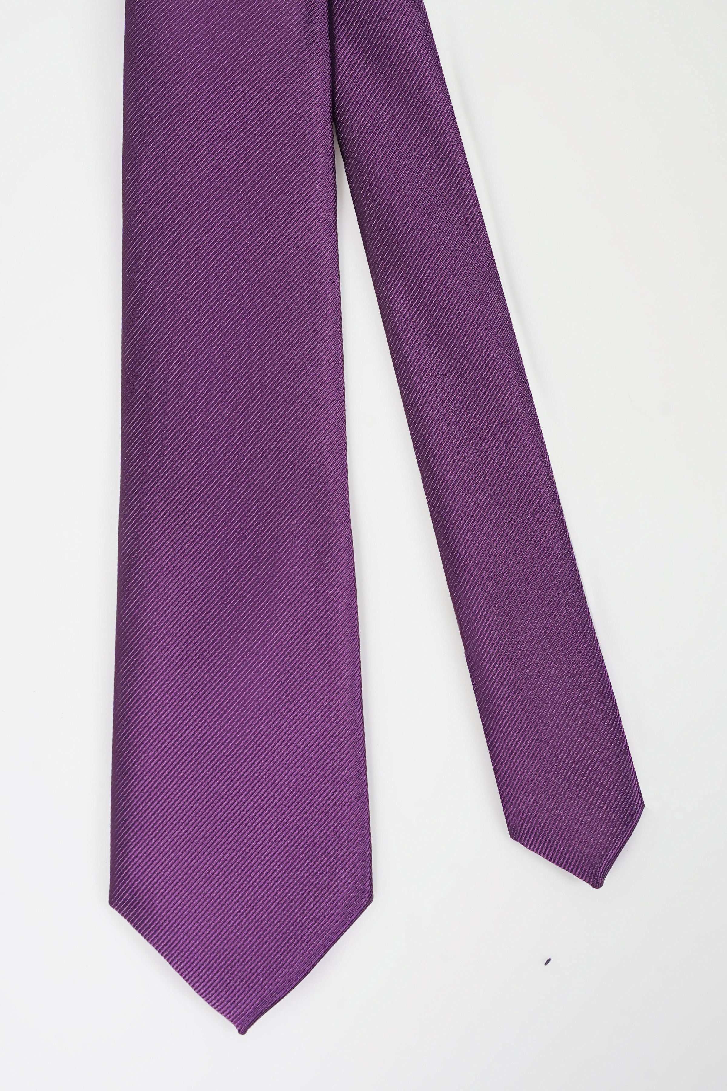 Purple textured necktie, pointed end and narrow width shown