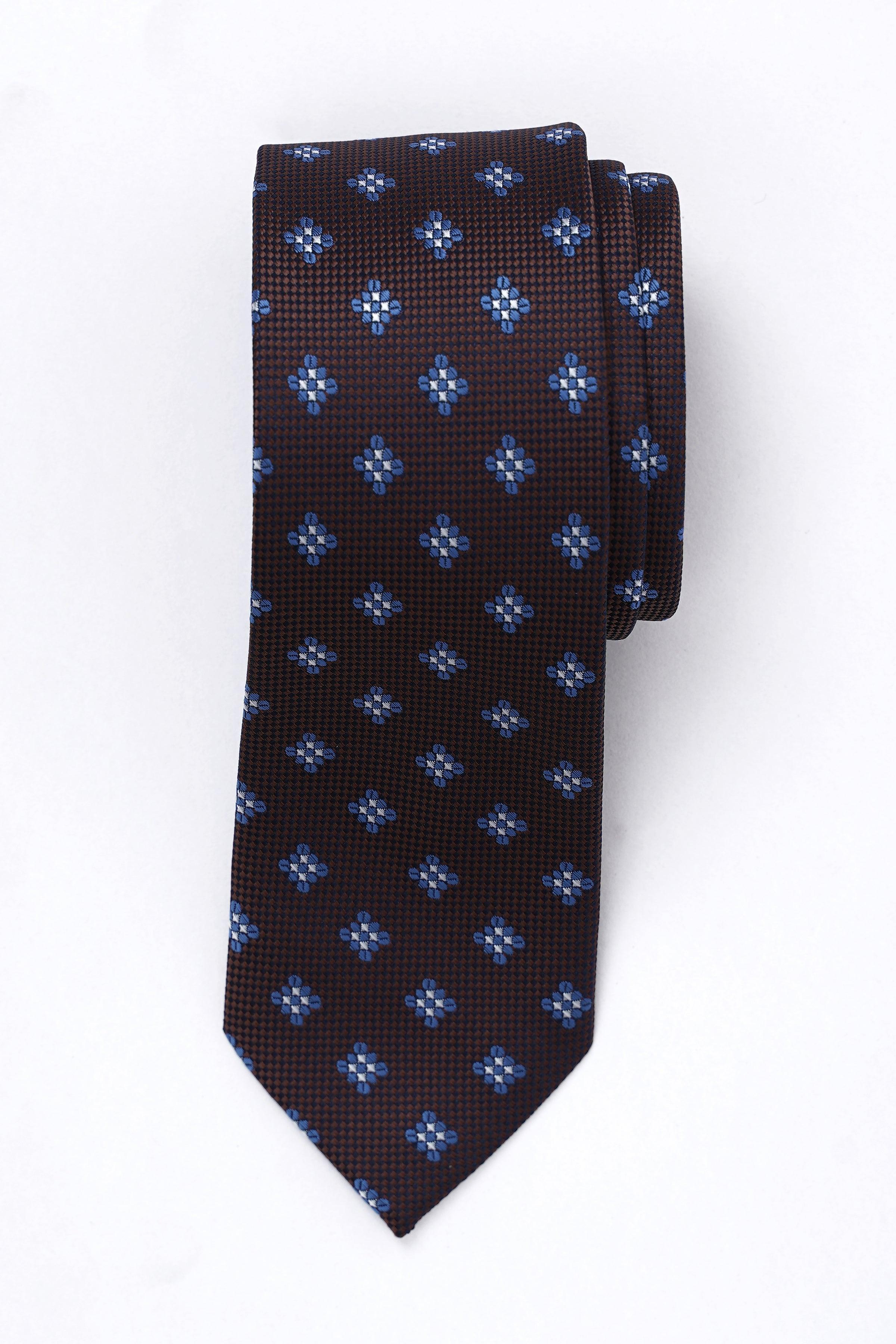 Dark brown necktie with small blue floral medallion pattern, slim width.