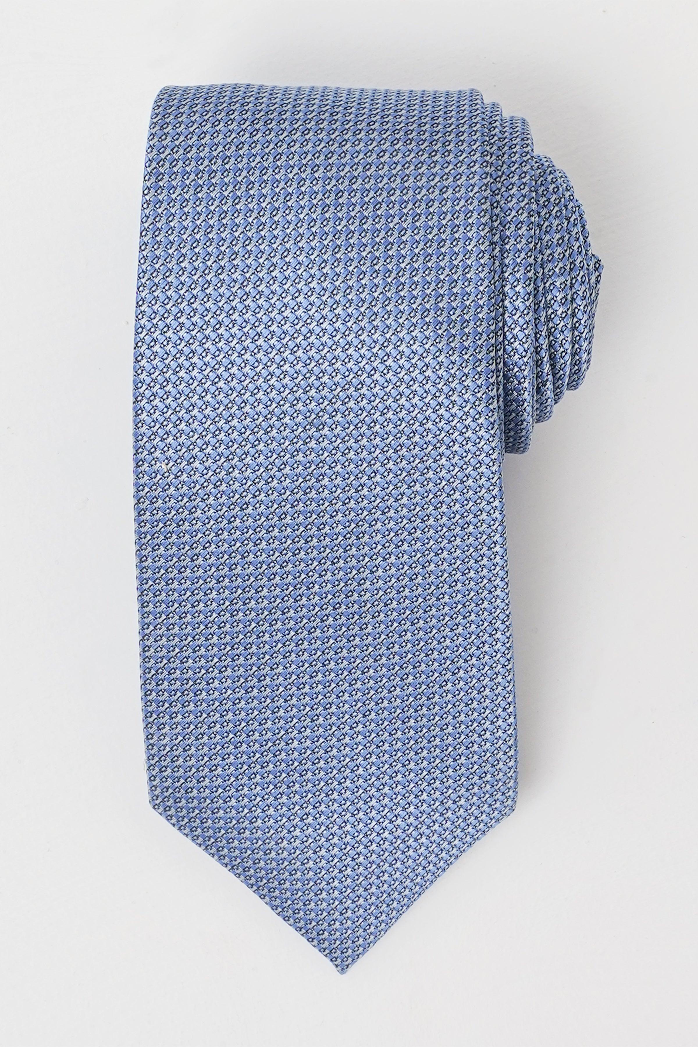 Blue woven necktie with small geometric pattern