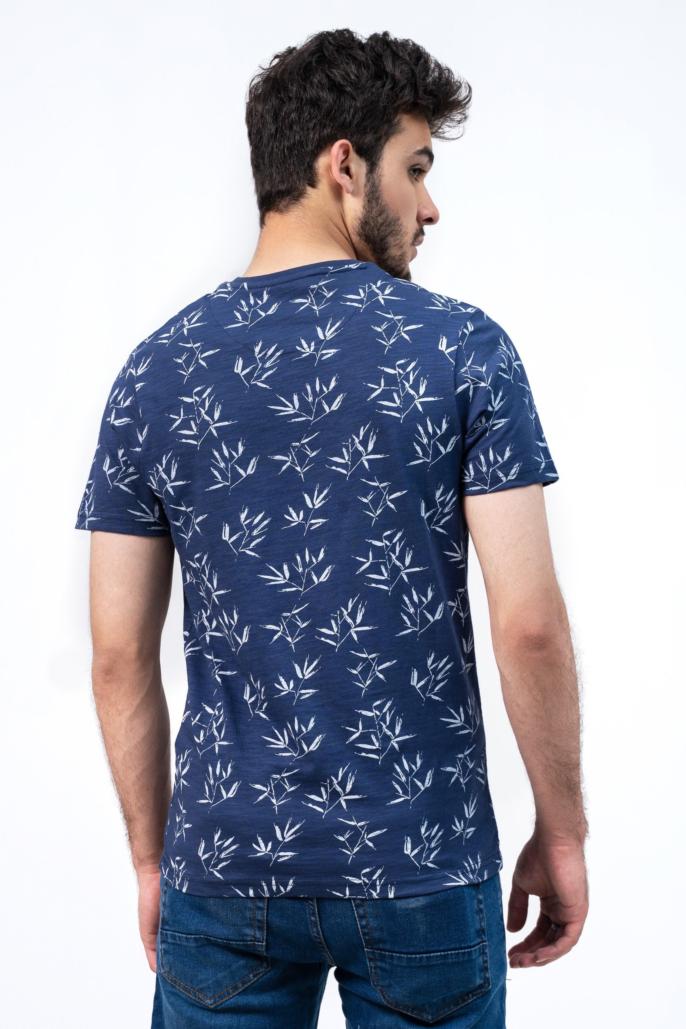 Men's navy printed T-shirt with white leaf pattern, back view, short sleeves