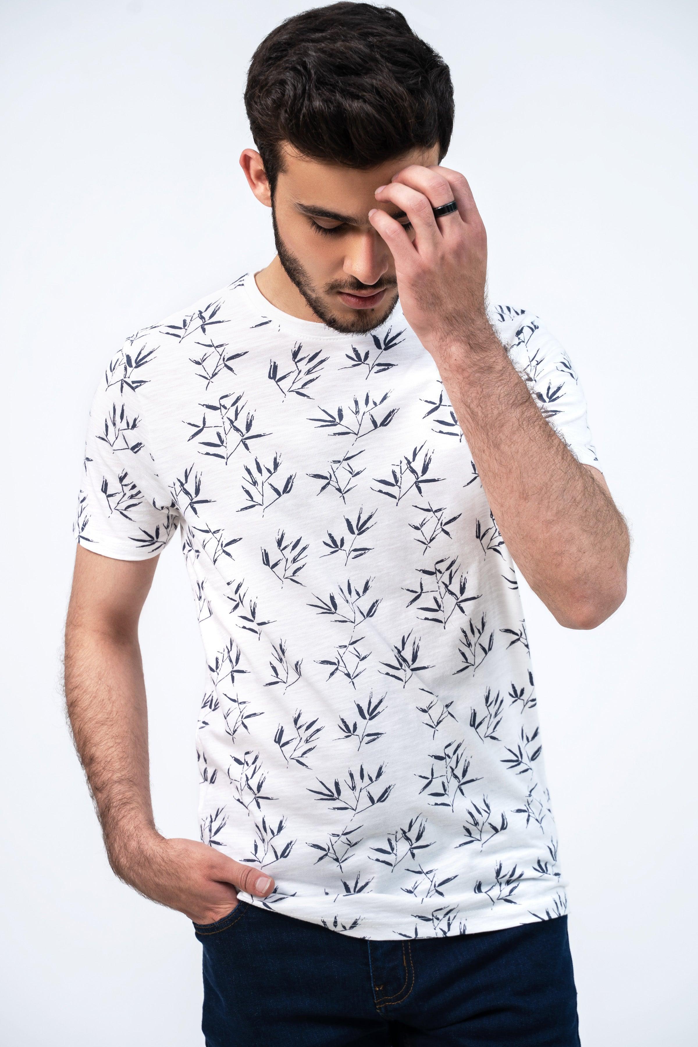 Off-white printed T-shirt with dark leaf pattern, crew neck and short sleeves