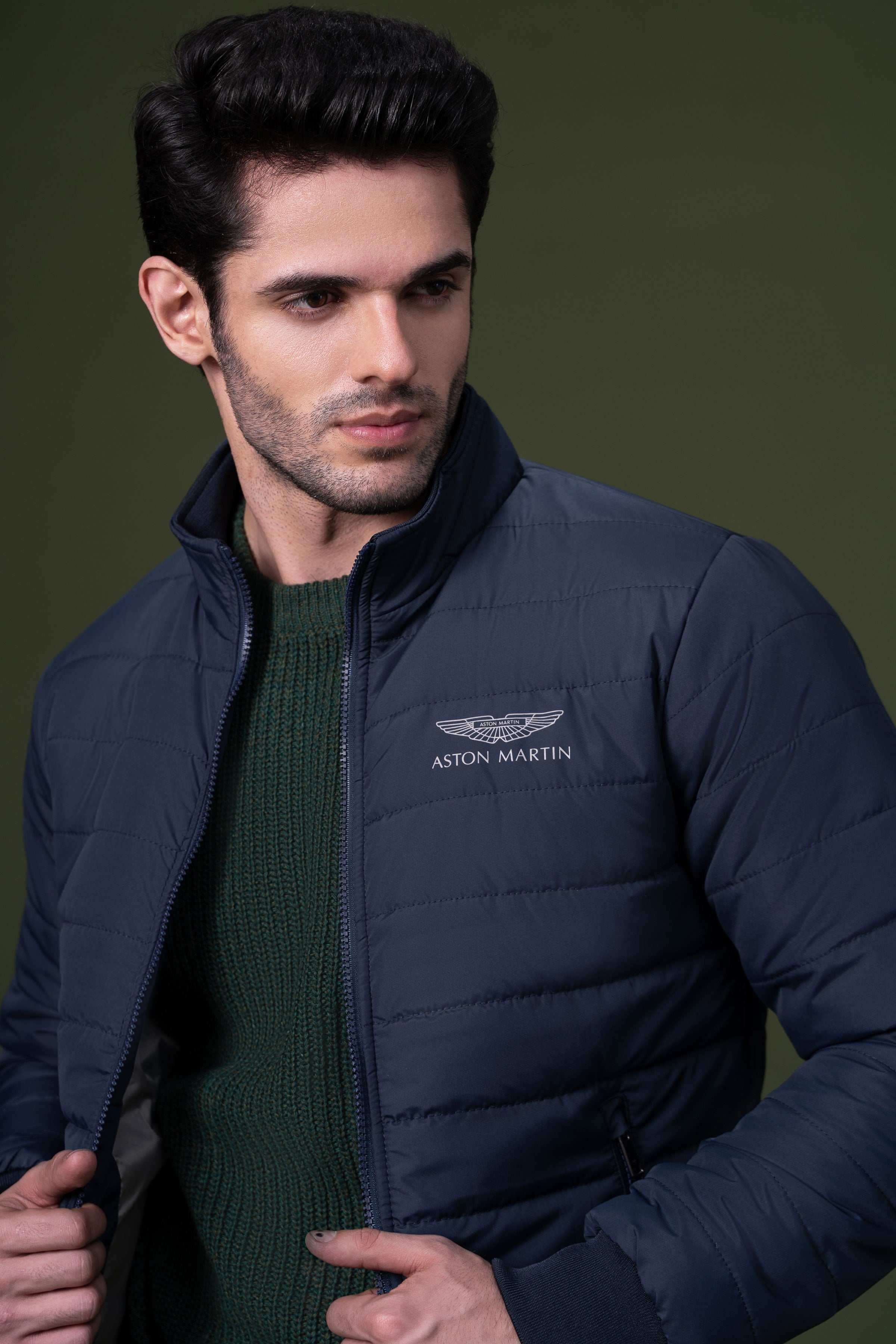 Puffer jacket close-up with Aston Martin logo on chest