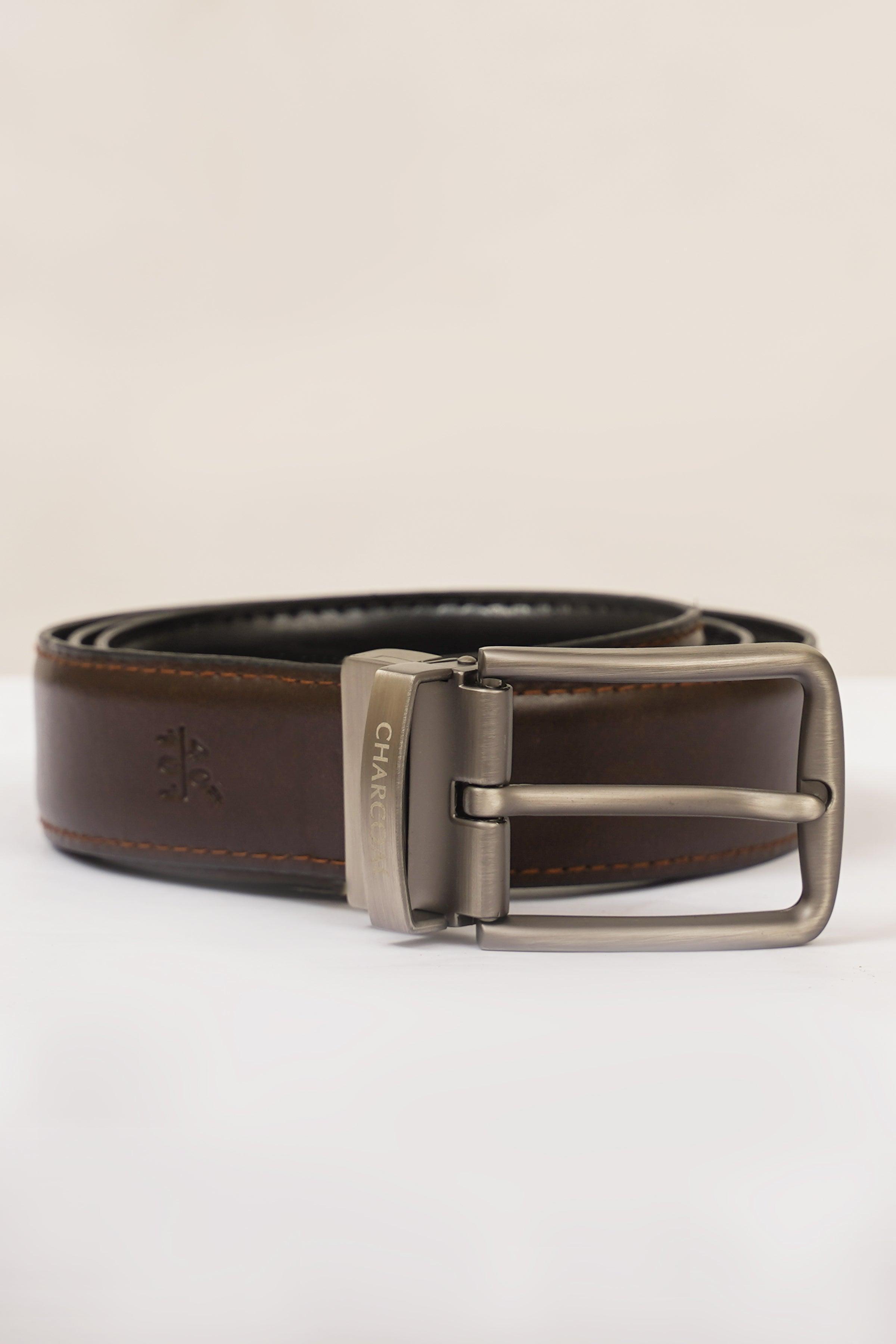 Reversible belt with silver buckle, dark brown leather and black reverse underside.