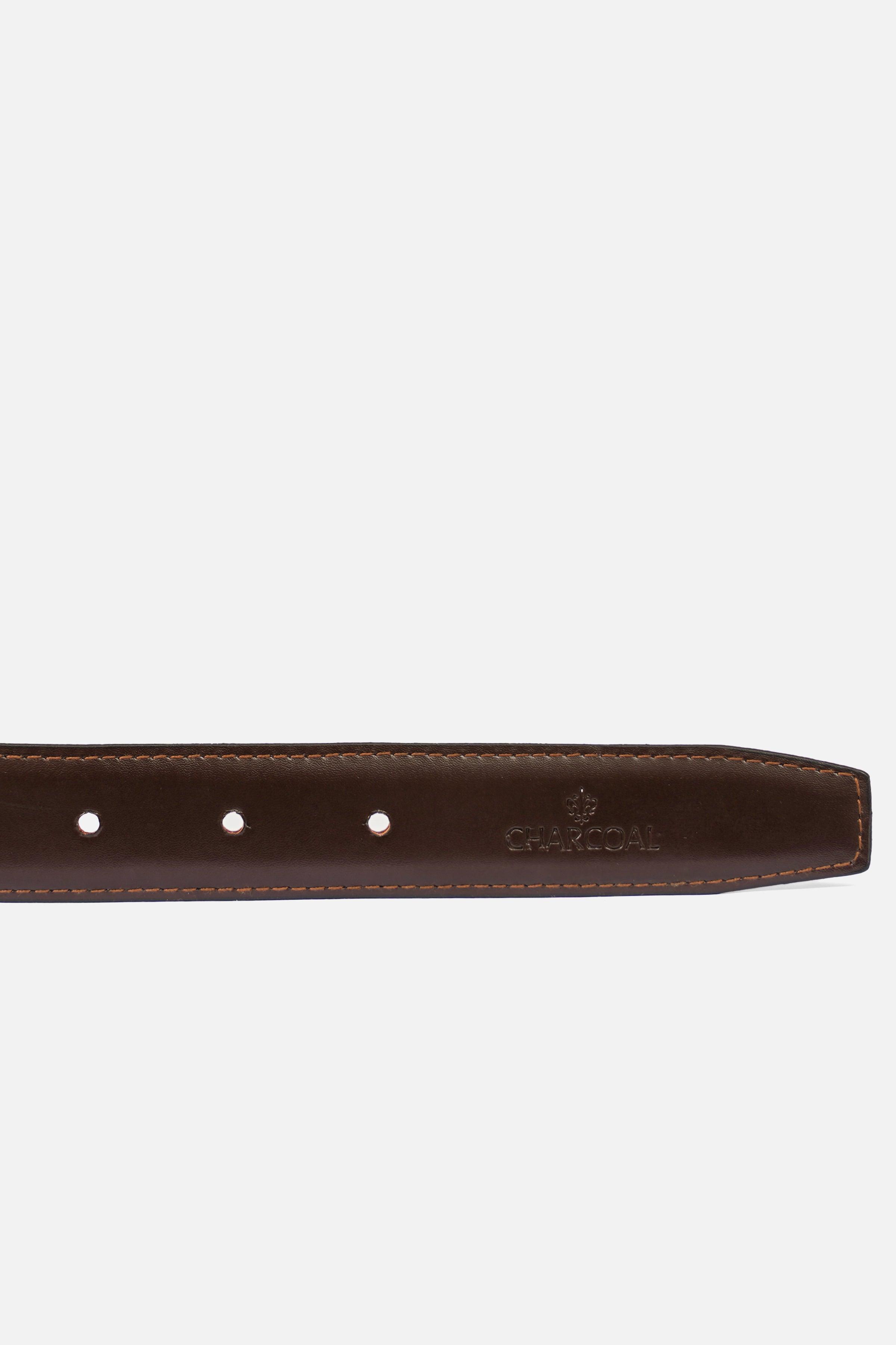 Leather belt strap detail with row of punched holes and embossed logo