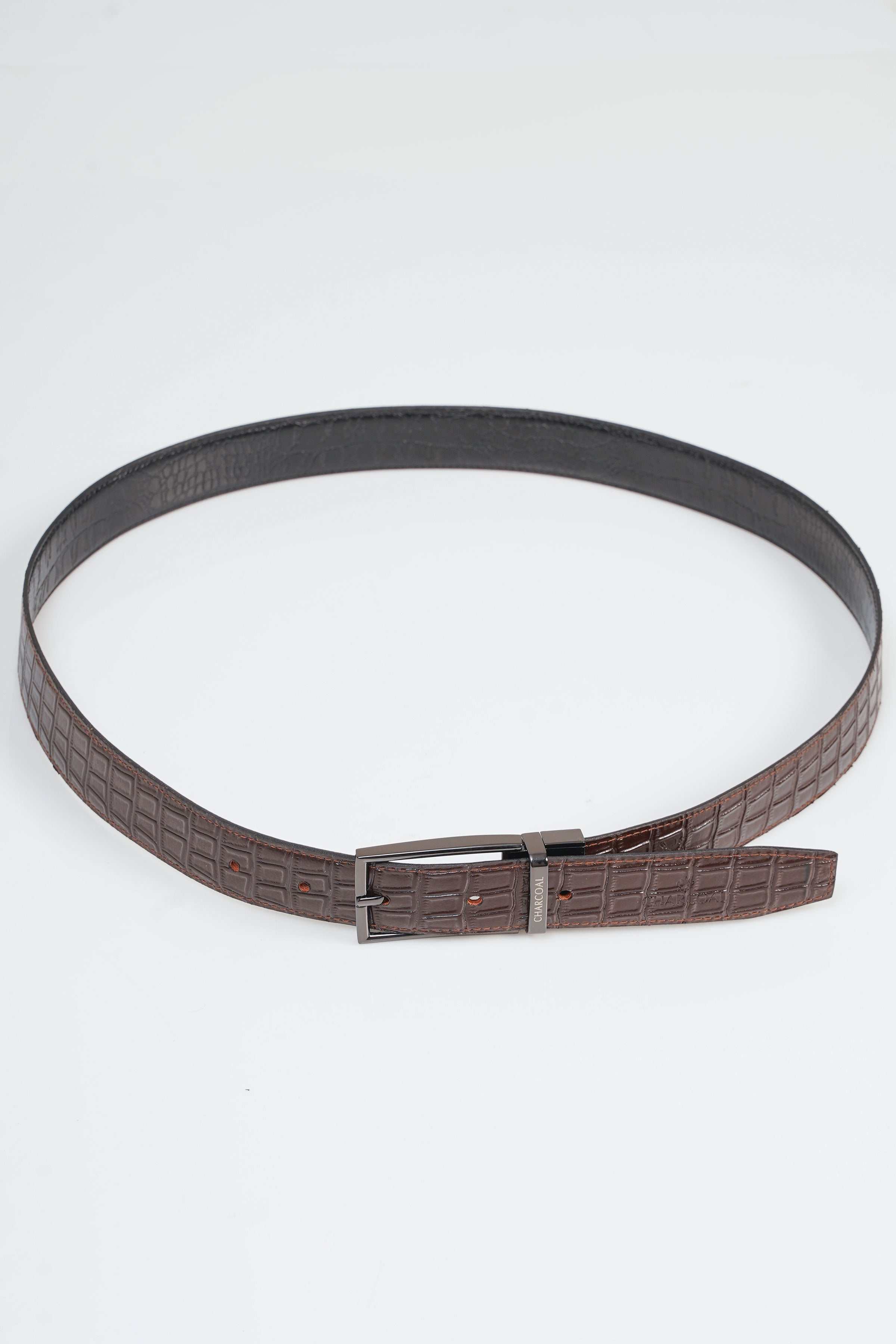 Reversible belt with dark brown textured strap and rectangular metal buckle
