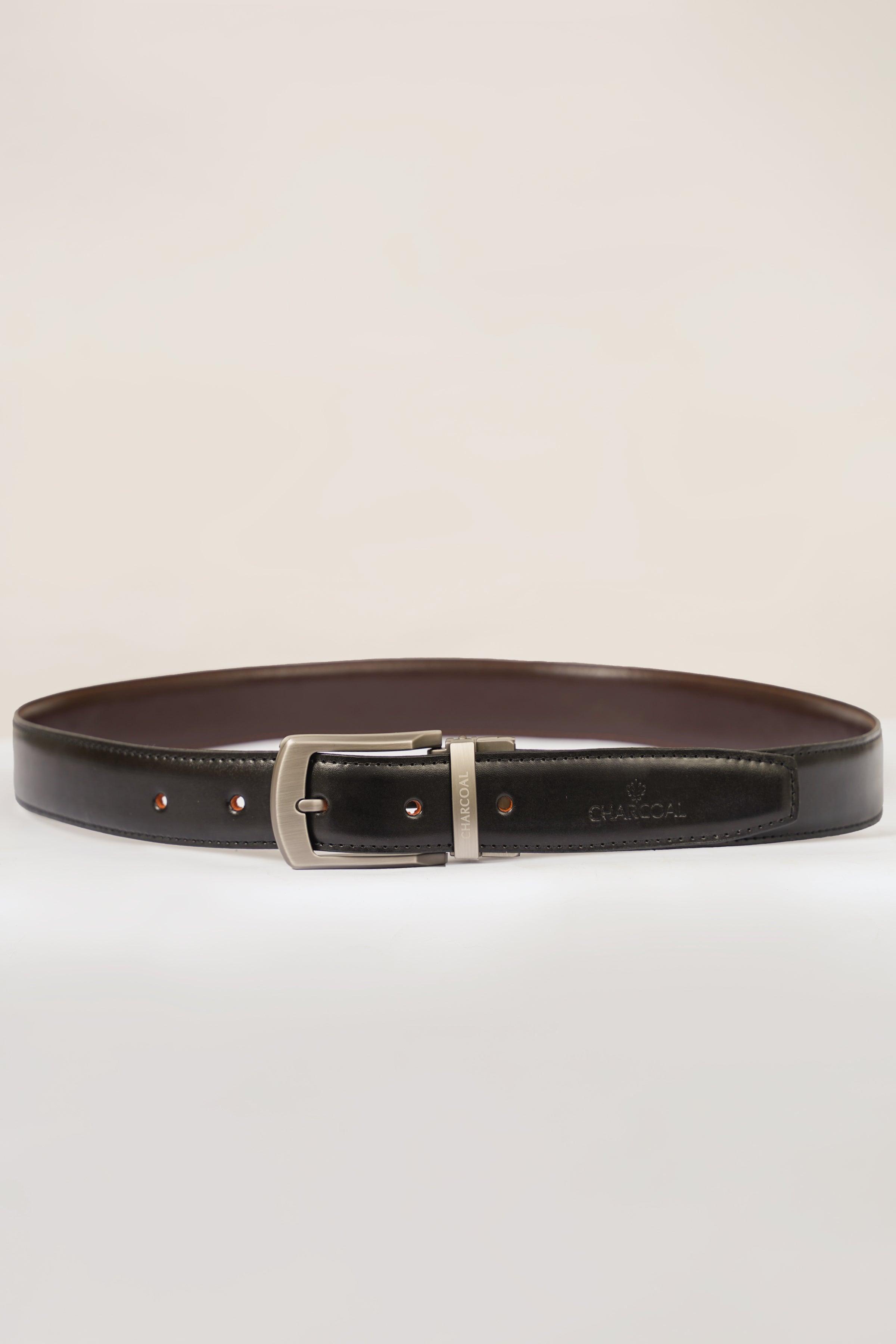Reversible belt with silver buckle, dark front and brown reverse side in flat layout.