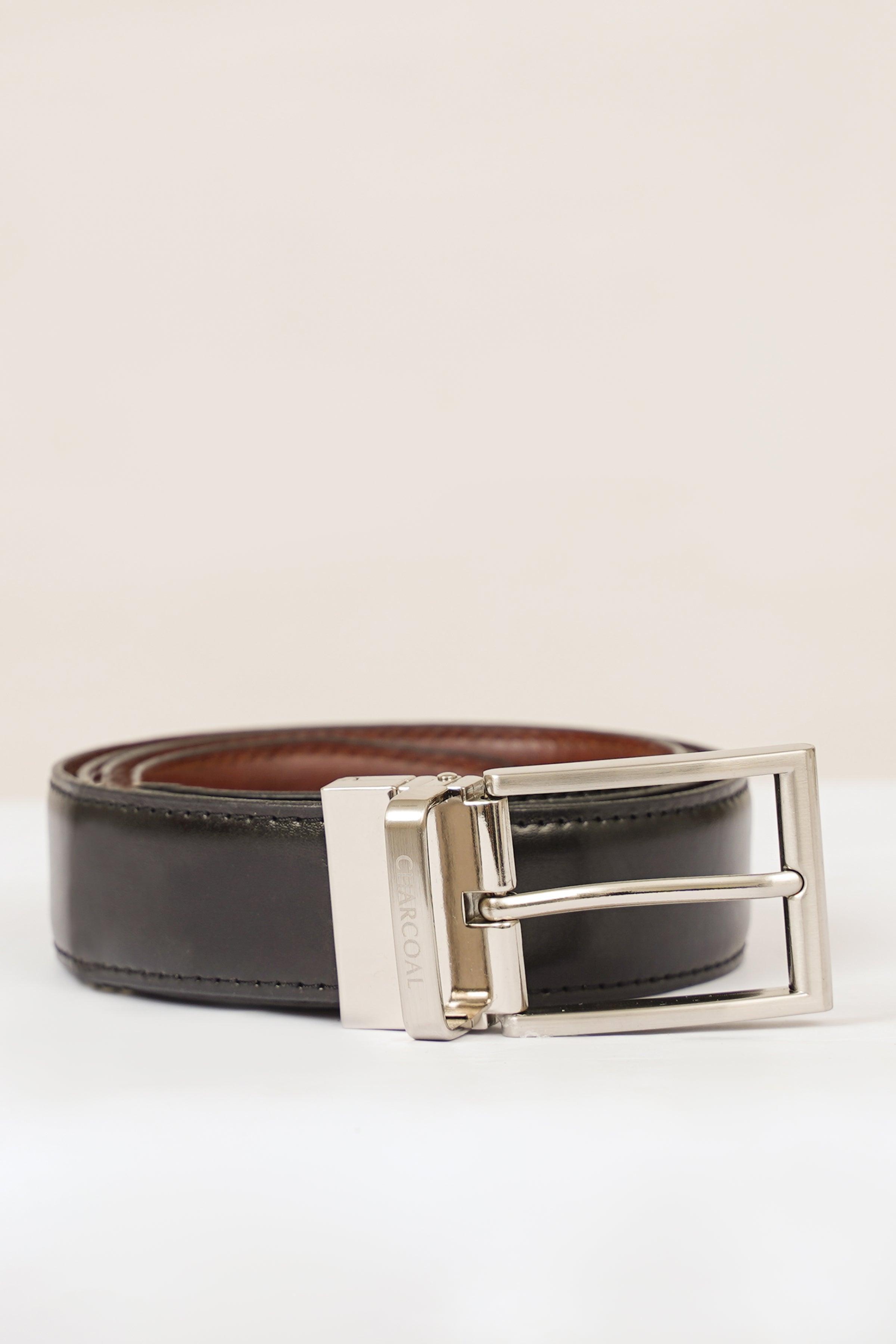 Reversible belt with silver buckle; dark leather front with brown reverse