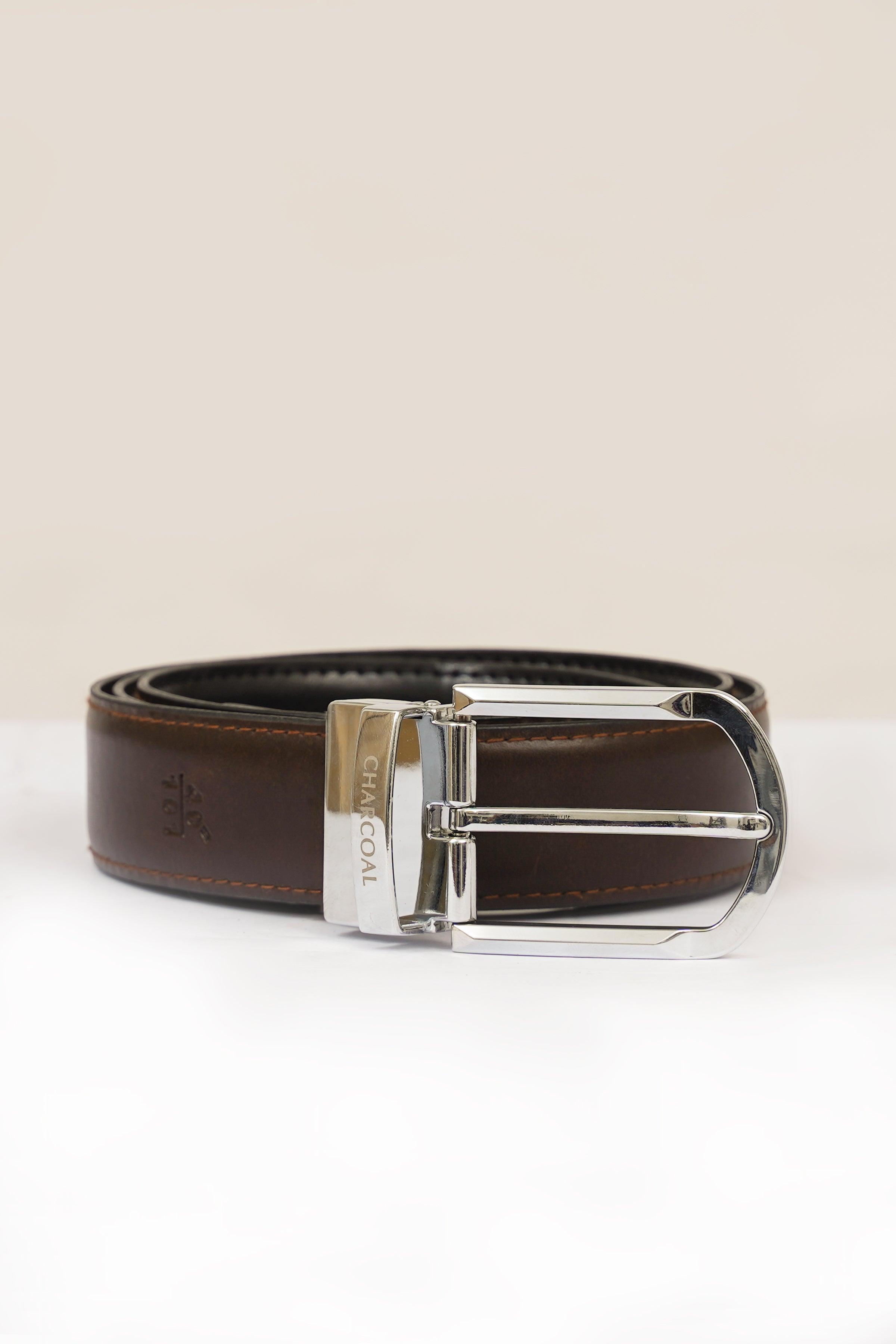 Reversible belt with silver buckle, brown strap and dark underside