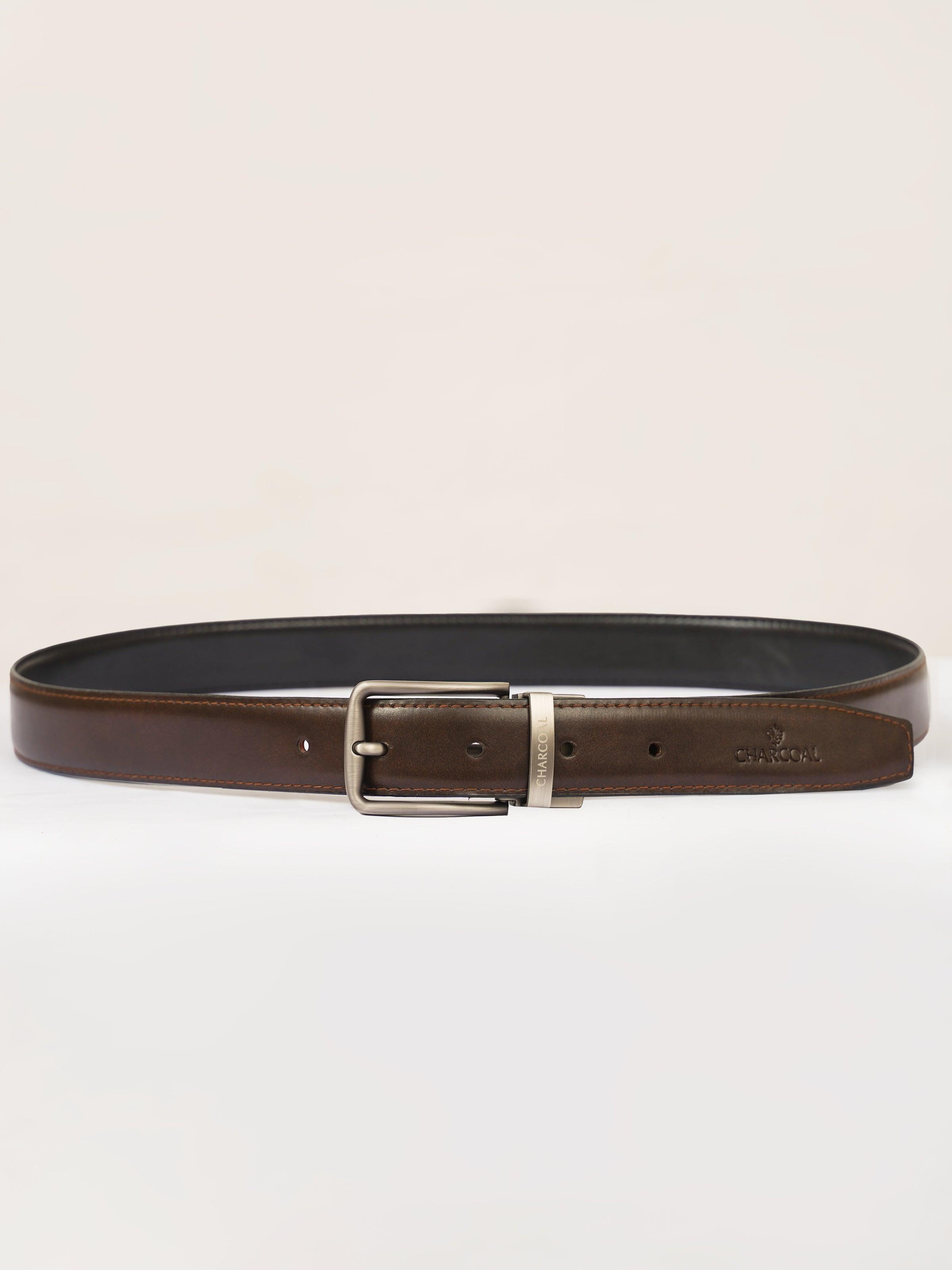 Reversible belt with silver buckle, dark brown outer and black inner with holes.