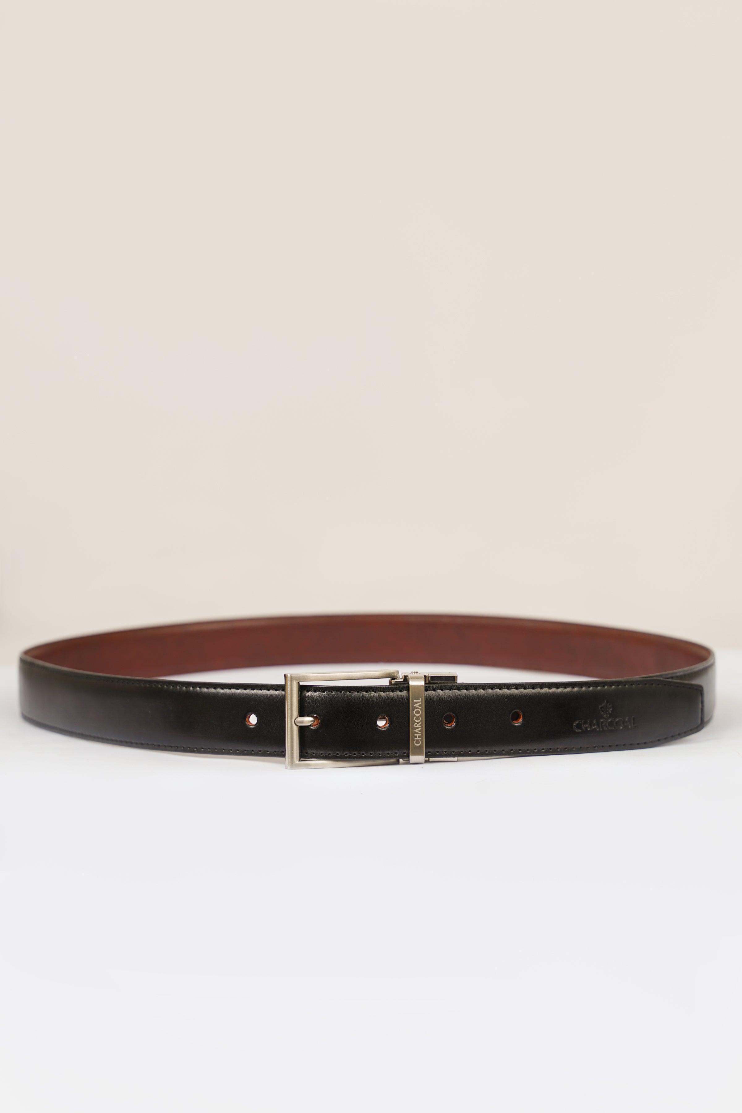 Reversible belt with silver buckle; brown leather top and dark leather underside