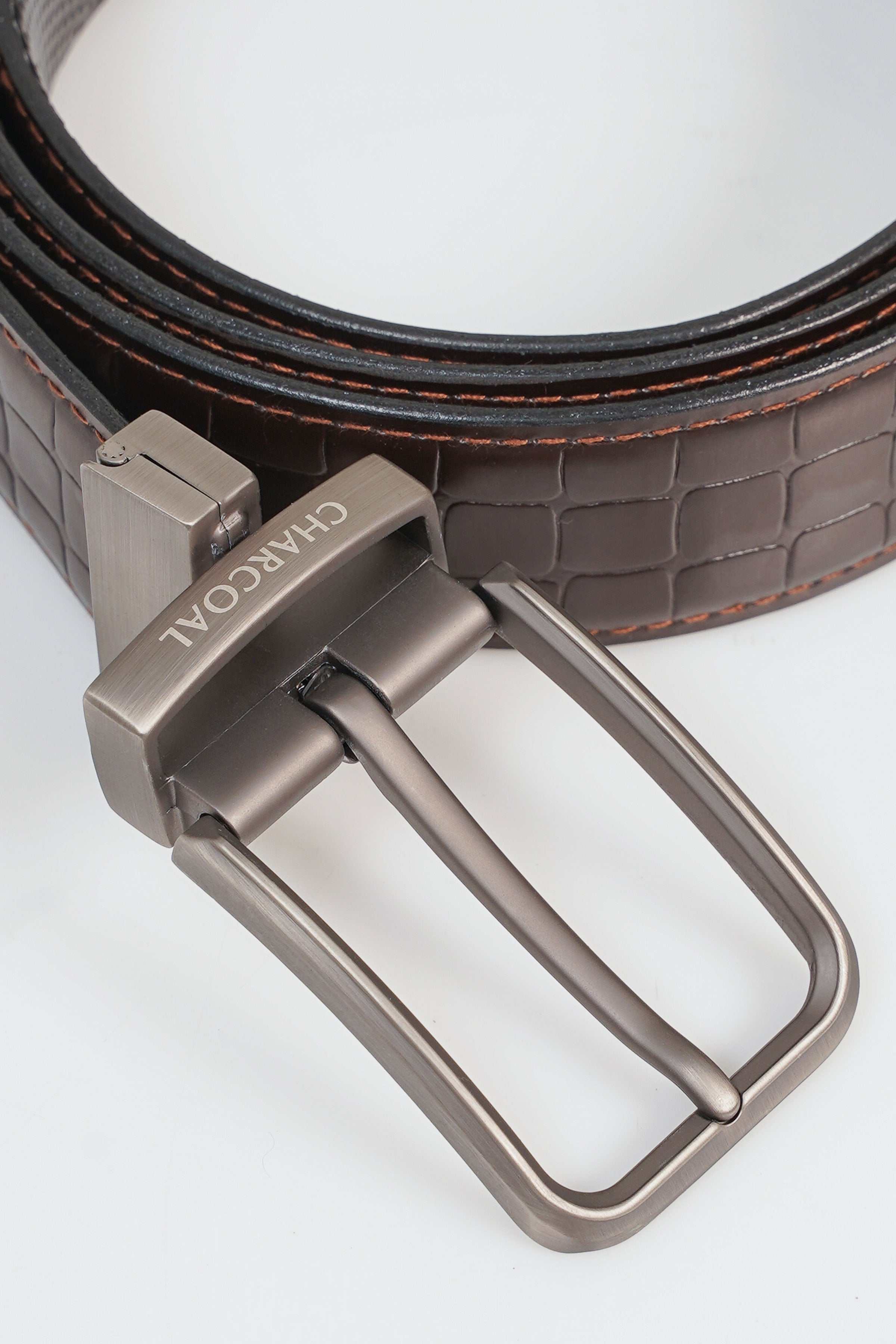 Reversible belt detail: metal buckle with prong, dark croc-texture leather strap