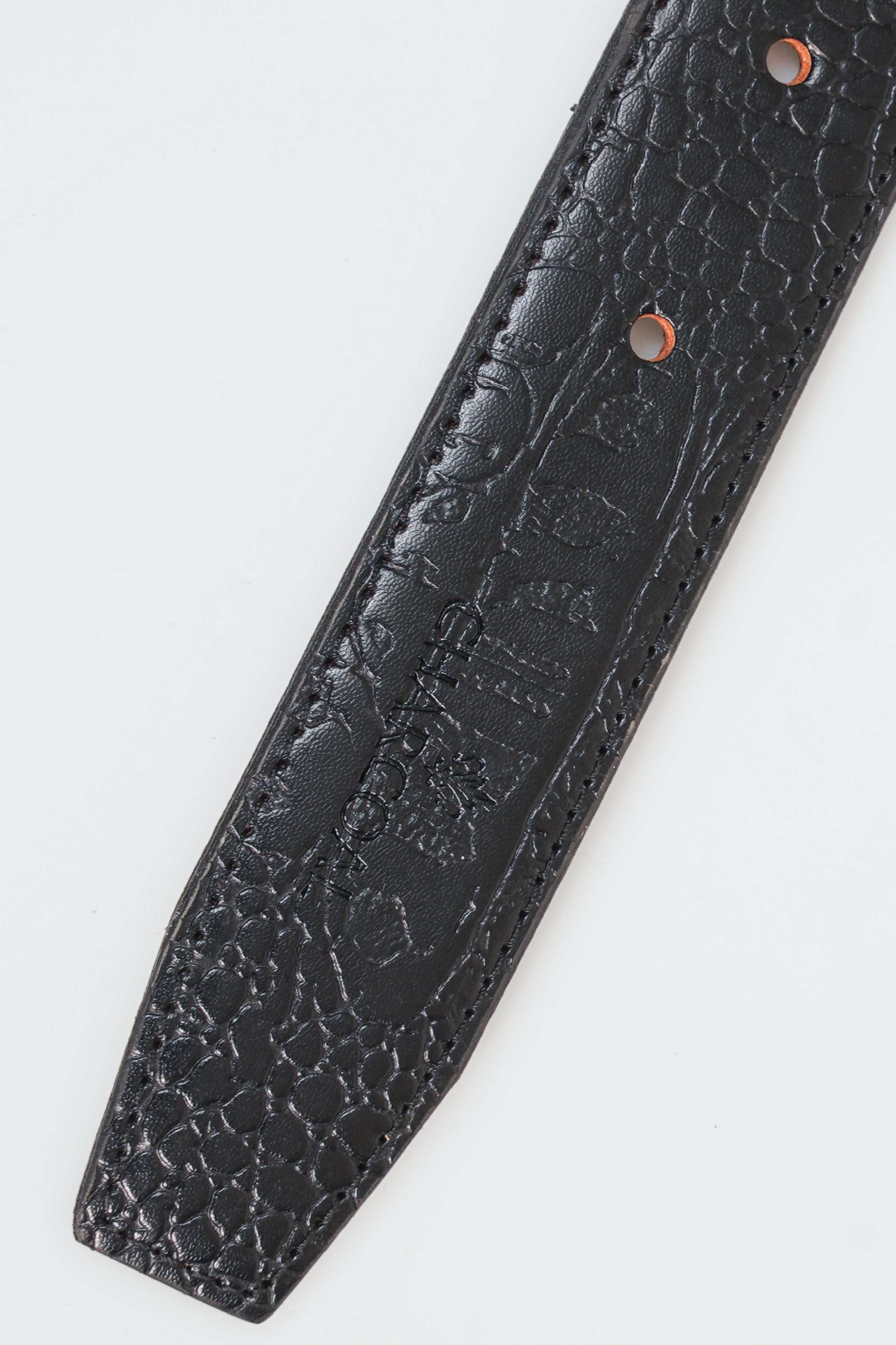 Textured leather-look belt strap with rivets and stitched pattern detail