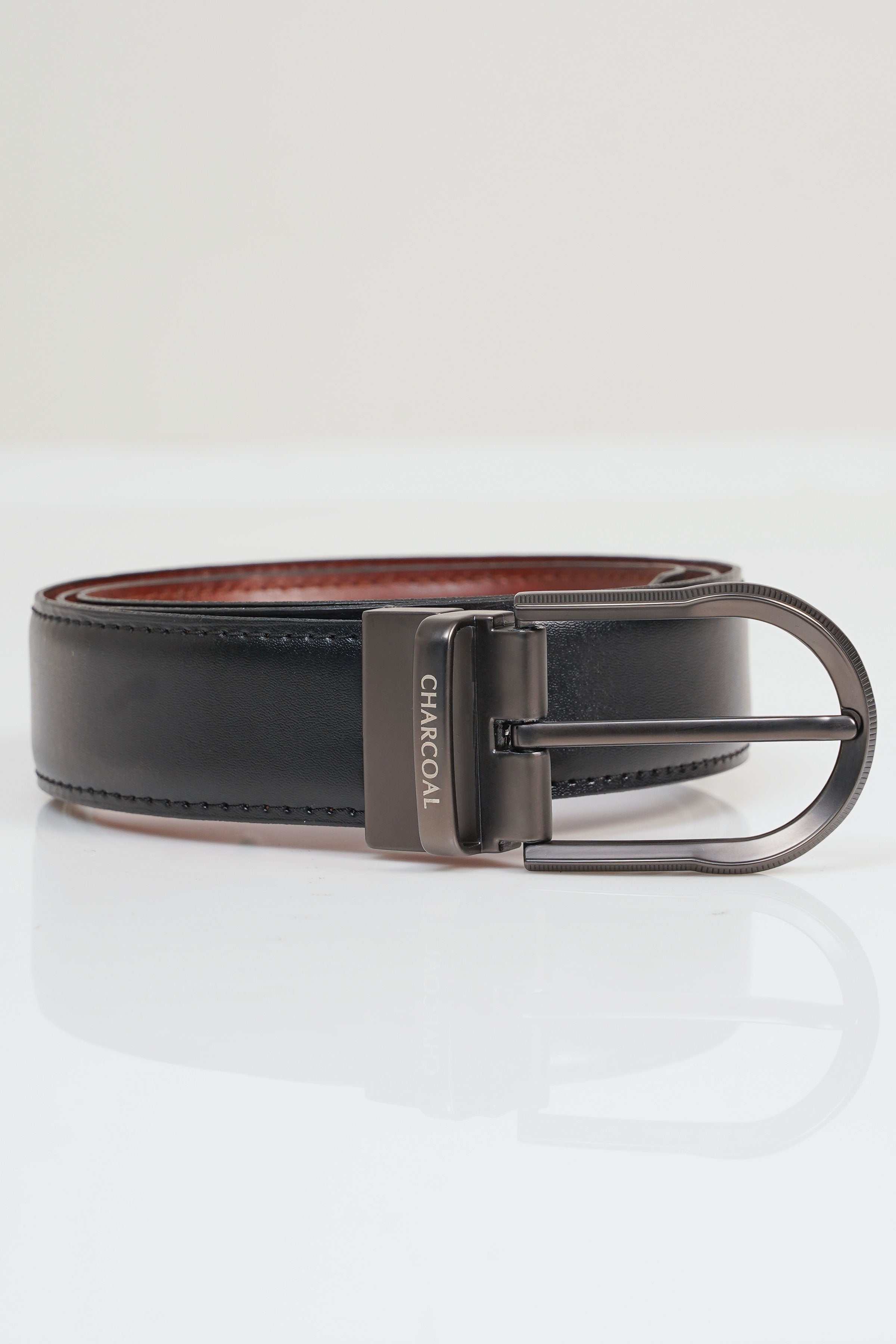 Reversible belt with dark leather strap and silver-tone metal buckle, two-tone finish