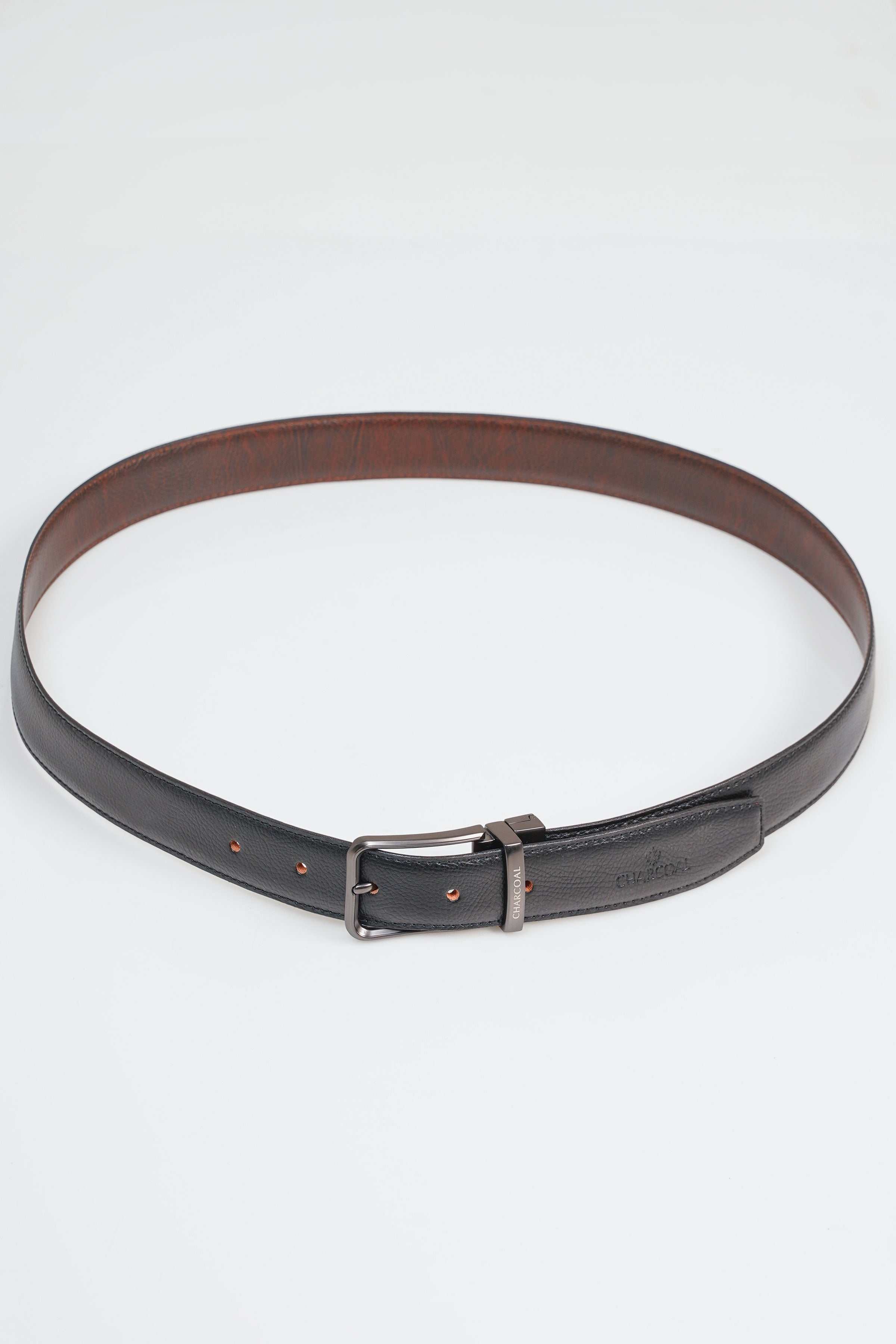 Reversible belt with brown and dark leather, metal buckle, punched holes