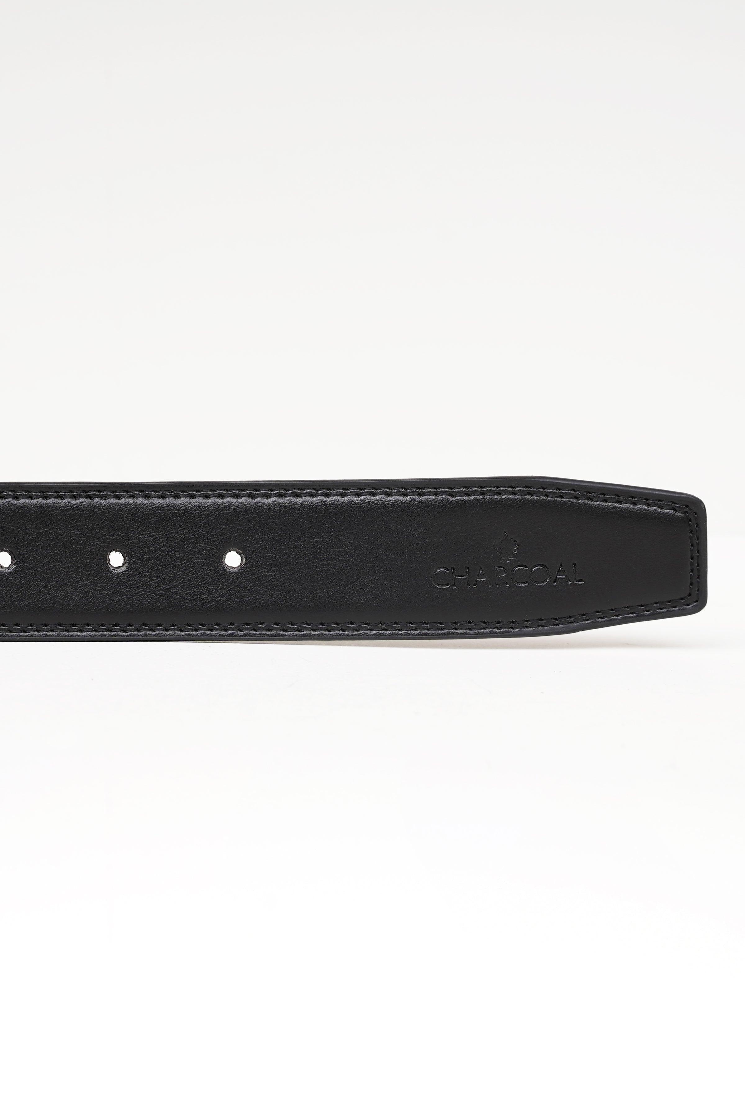 Reversible belt close-up with three prong holes and embossed logo on dark strap