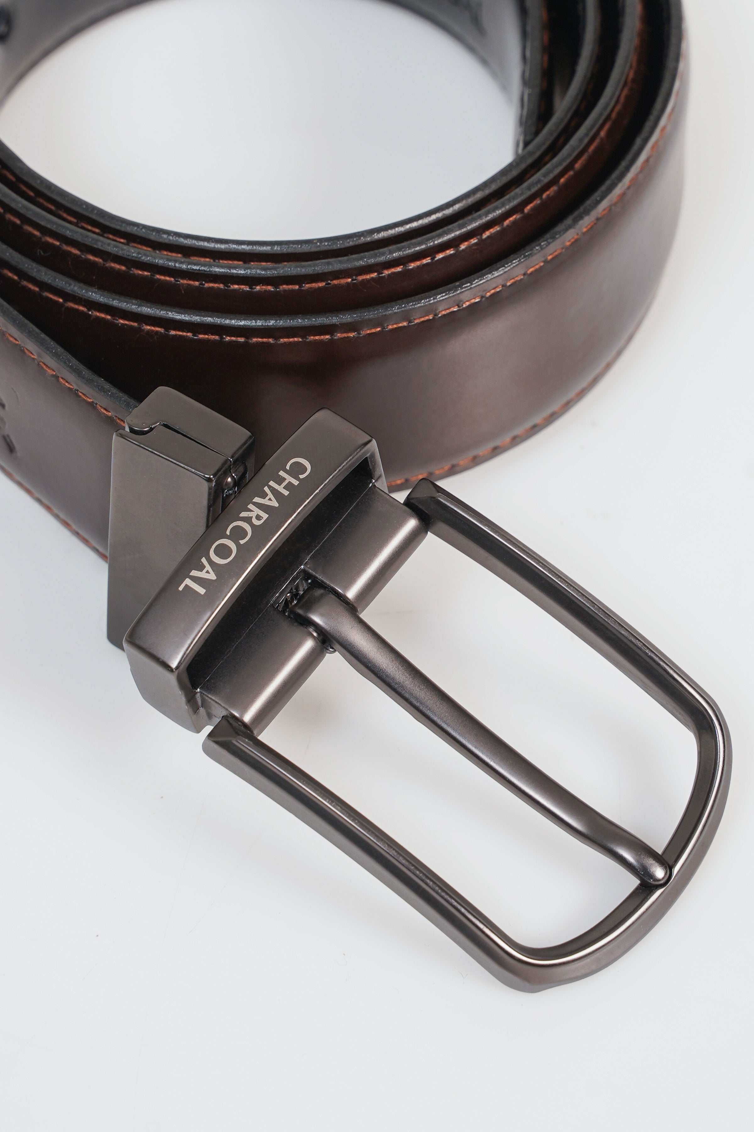 Brown leather belt with silver-toned rectangular buckle and double prong