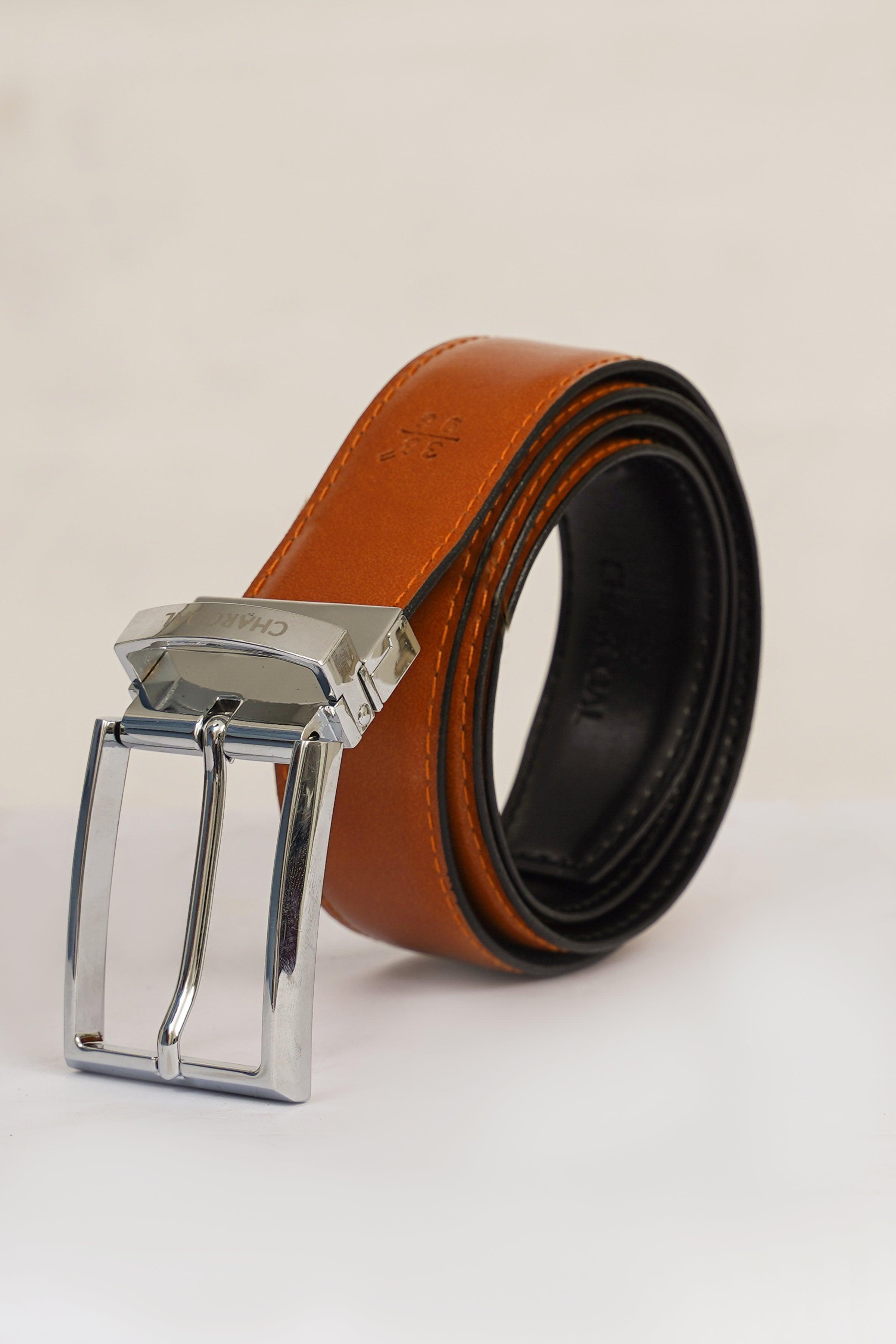 Reversible belt with orange leather strap and black underside, silver buckle