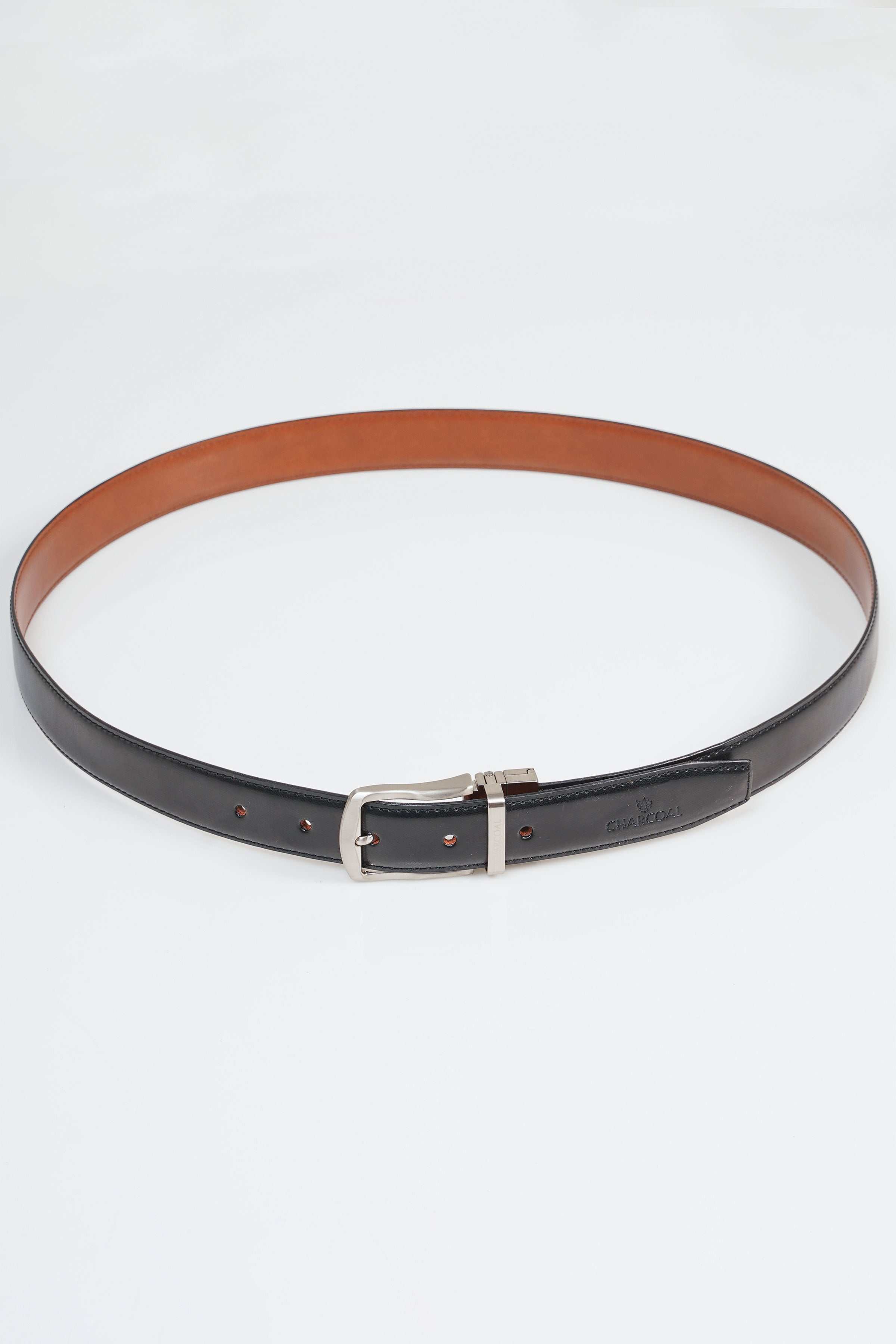 Reversible belt with dark underside and light brown top, silver buckle