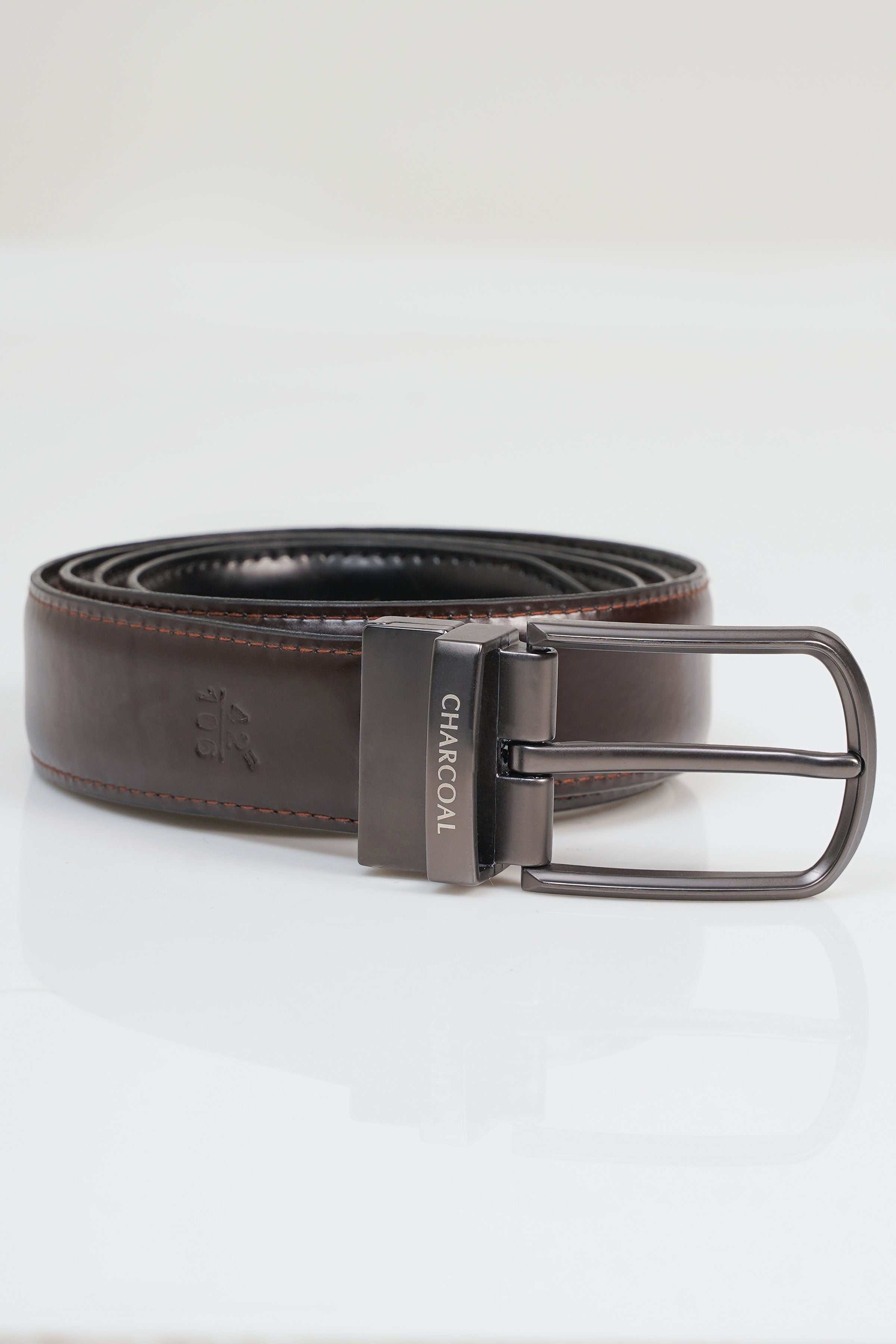 Brown leather belt with metal rectangular buckle and stitched edges