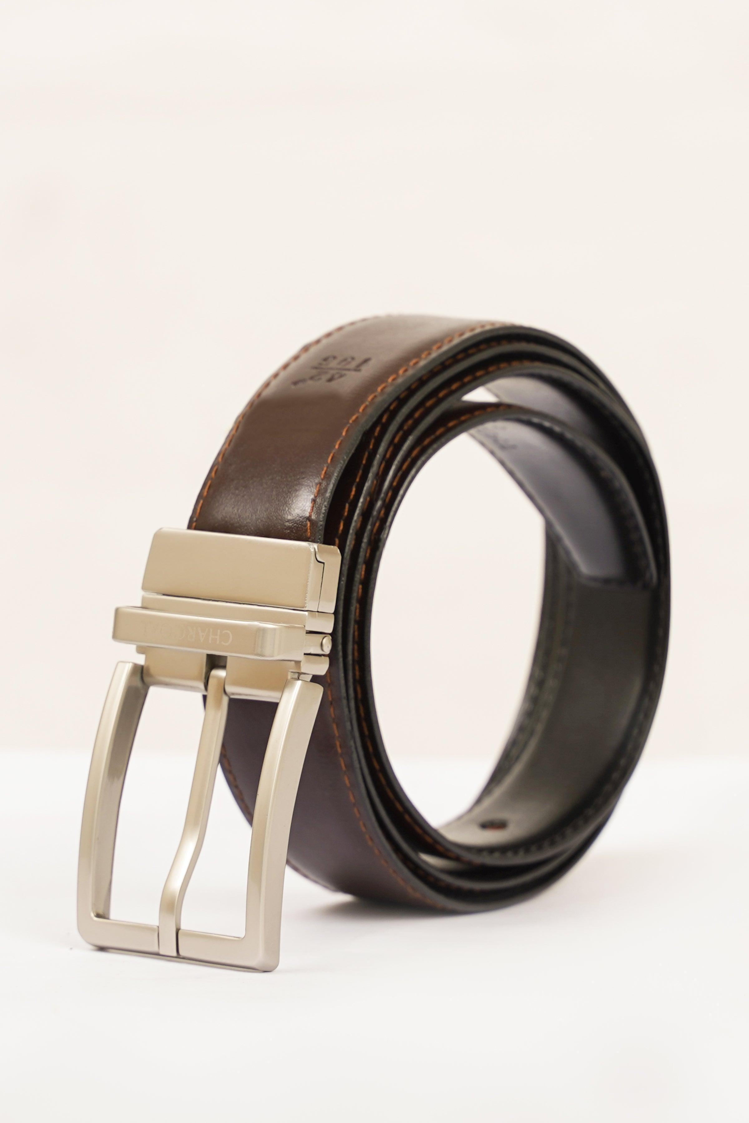 Reversible belt with silver square buckle; brown and black leather straps