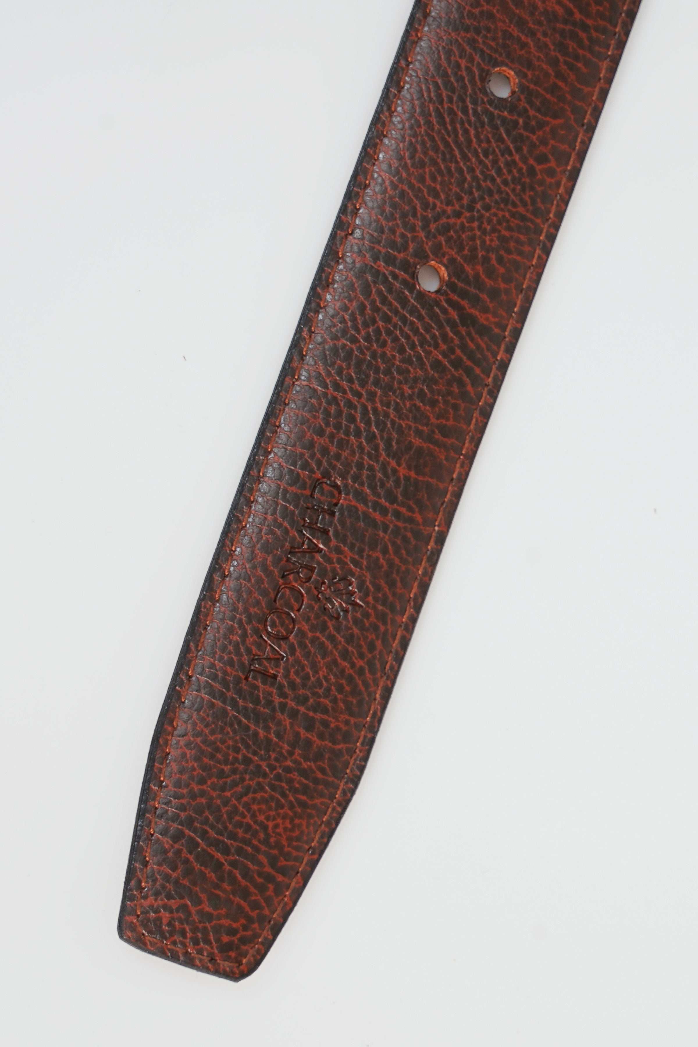 Brown leather belt strap with punched holes and textured finish
