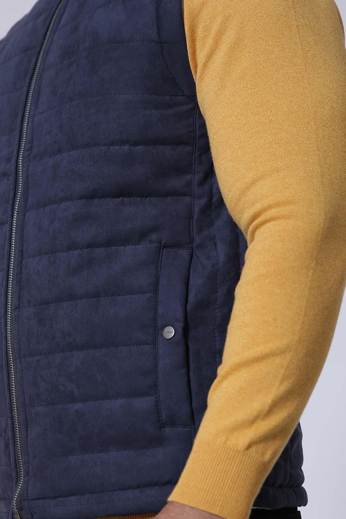 Navy padded sleeveless jacket front with quilting, zipper, and snap button pocket