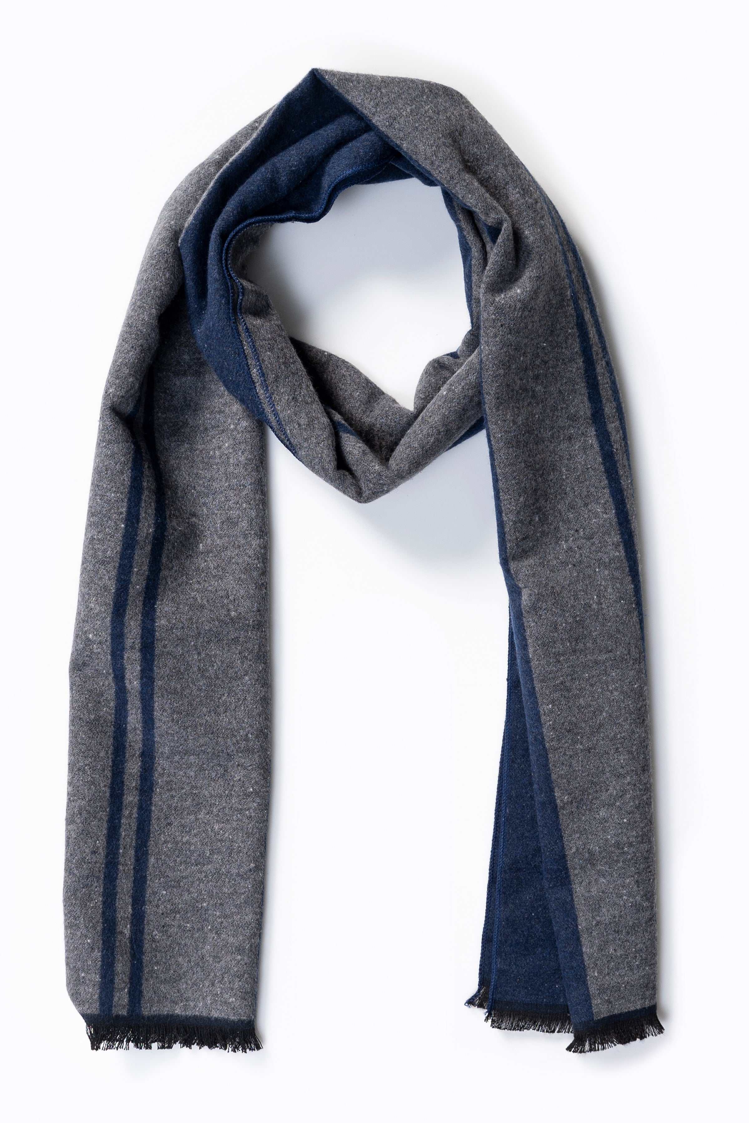Two-tone striped scarf draped with navy and gray panels, fringed edges