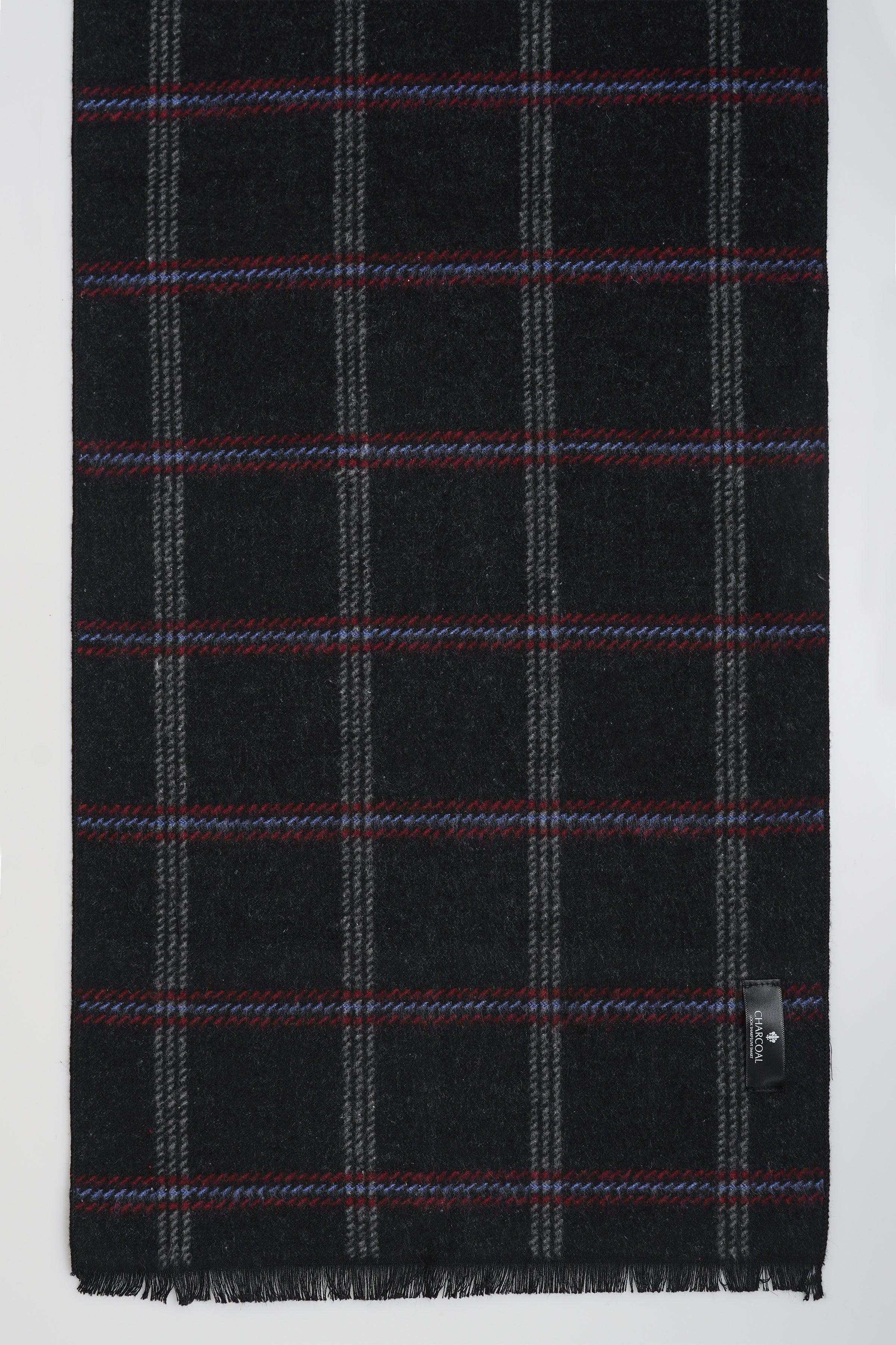Black plaid scarf with red and gray grid lines; fringed hem, small side tag.
