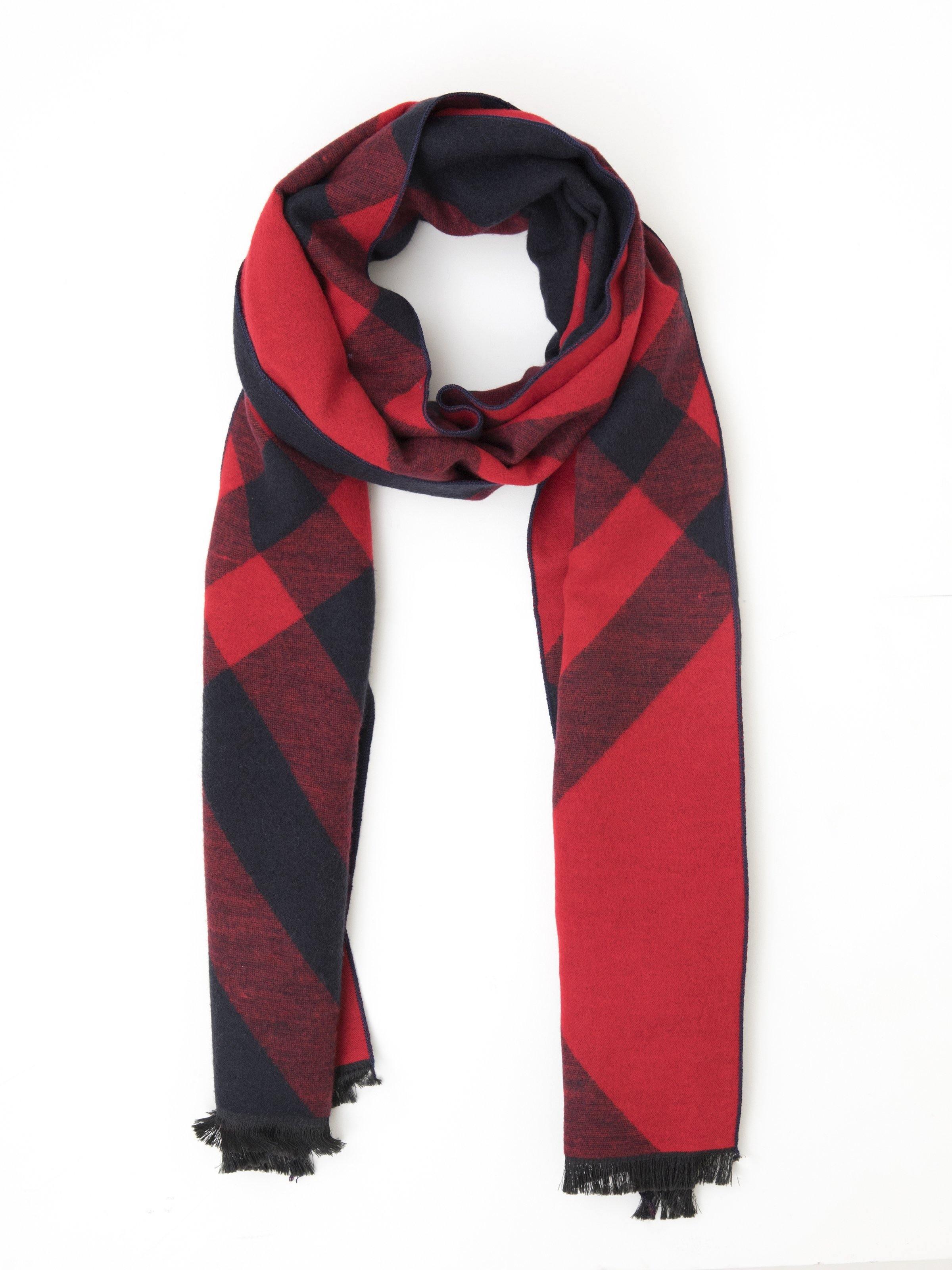 Red and navy plaid scarf with fringed ends, draped on a model