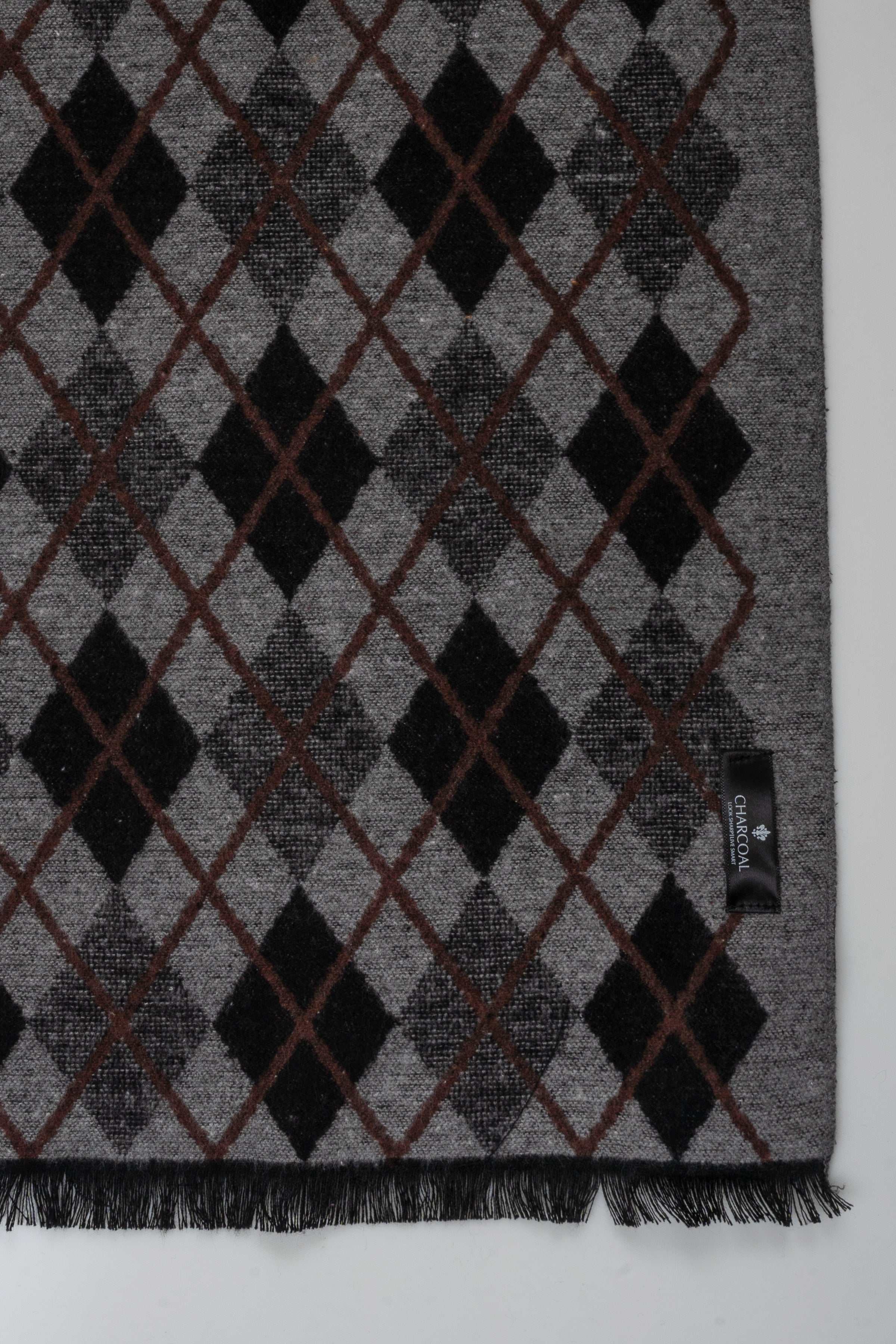 Grey scarf with dark argyle checks and fringe ends