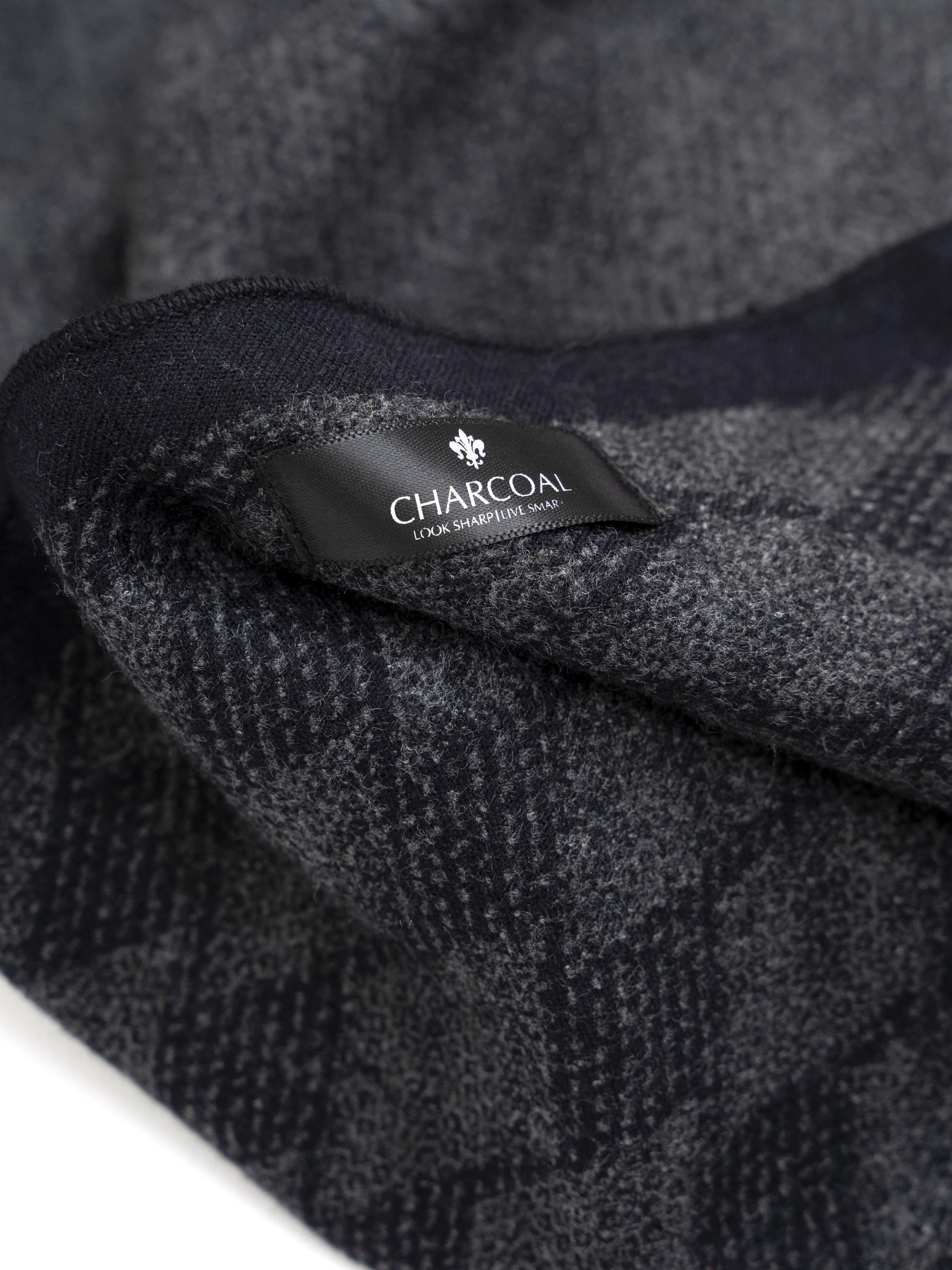 Scarf fabric close-up with black label reading CHARCOAL and textured weave