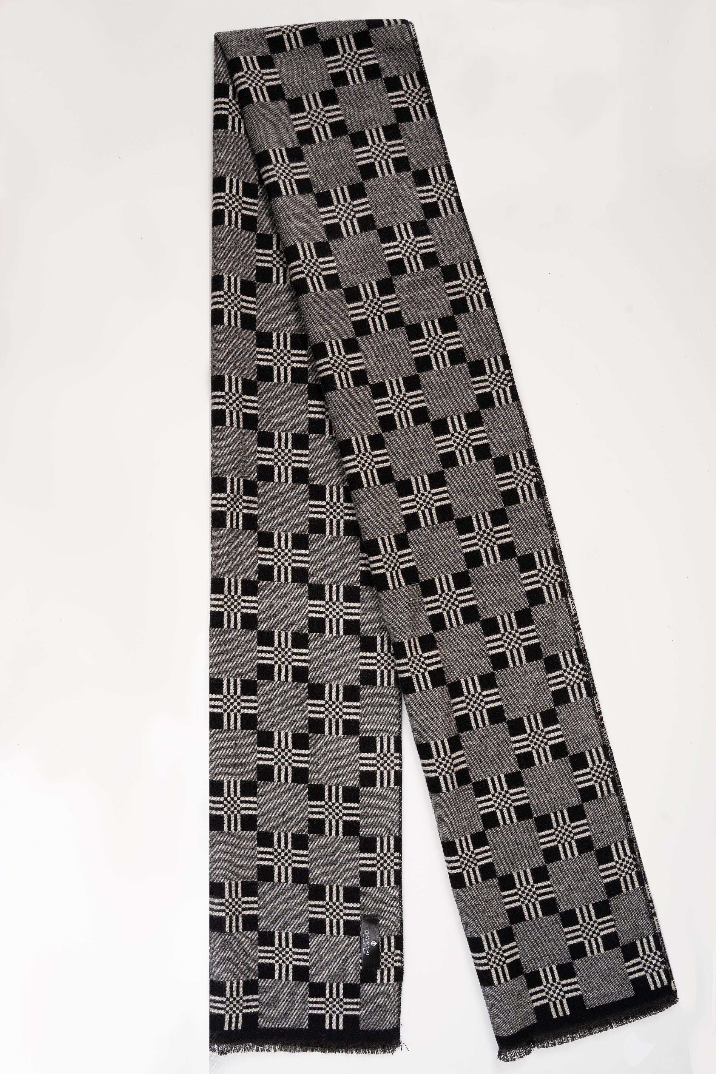 Dark gray plaid scarf with black and white checks, folded, fringed ends.