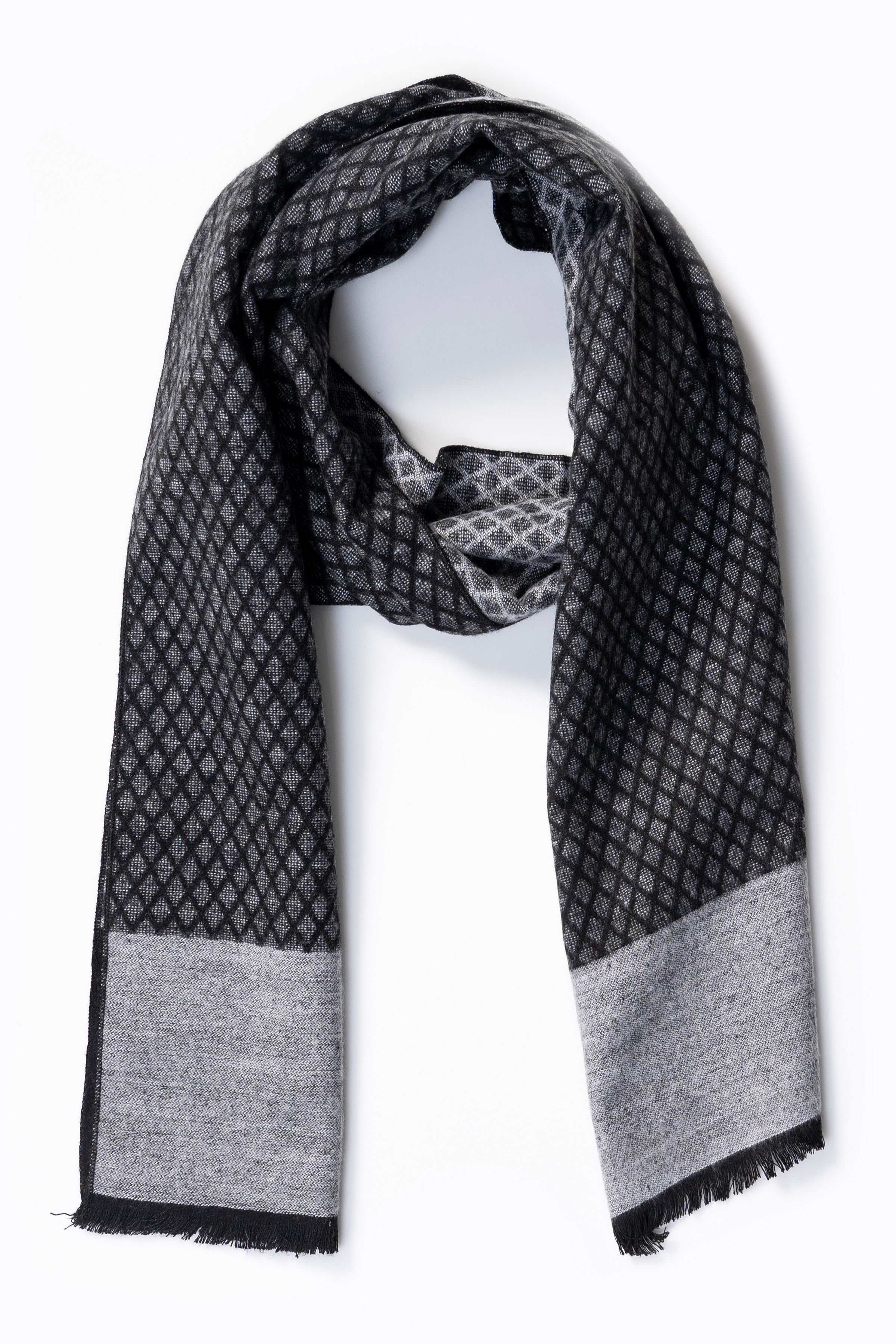 Black patterned scarf with gray hem and fringed ends