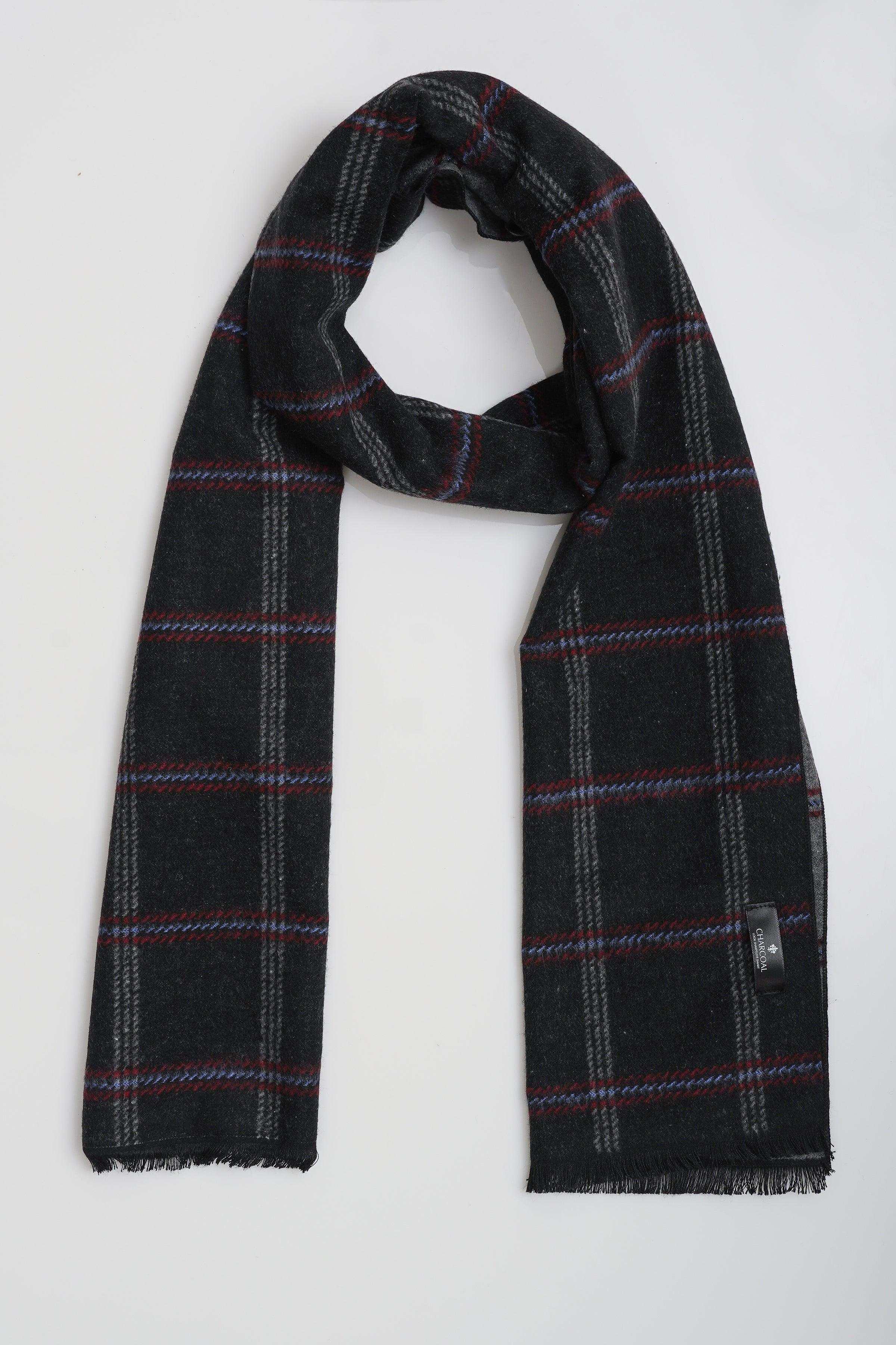 Draped plaid scarf in dark tones with red and gray grid lines, fringed ends.