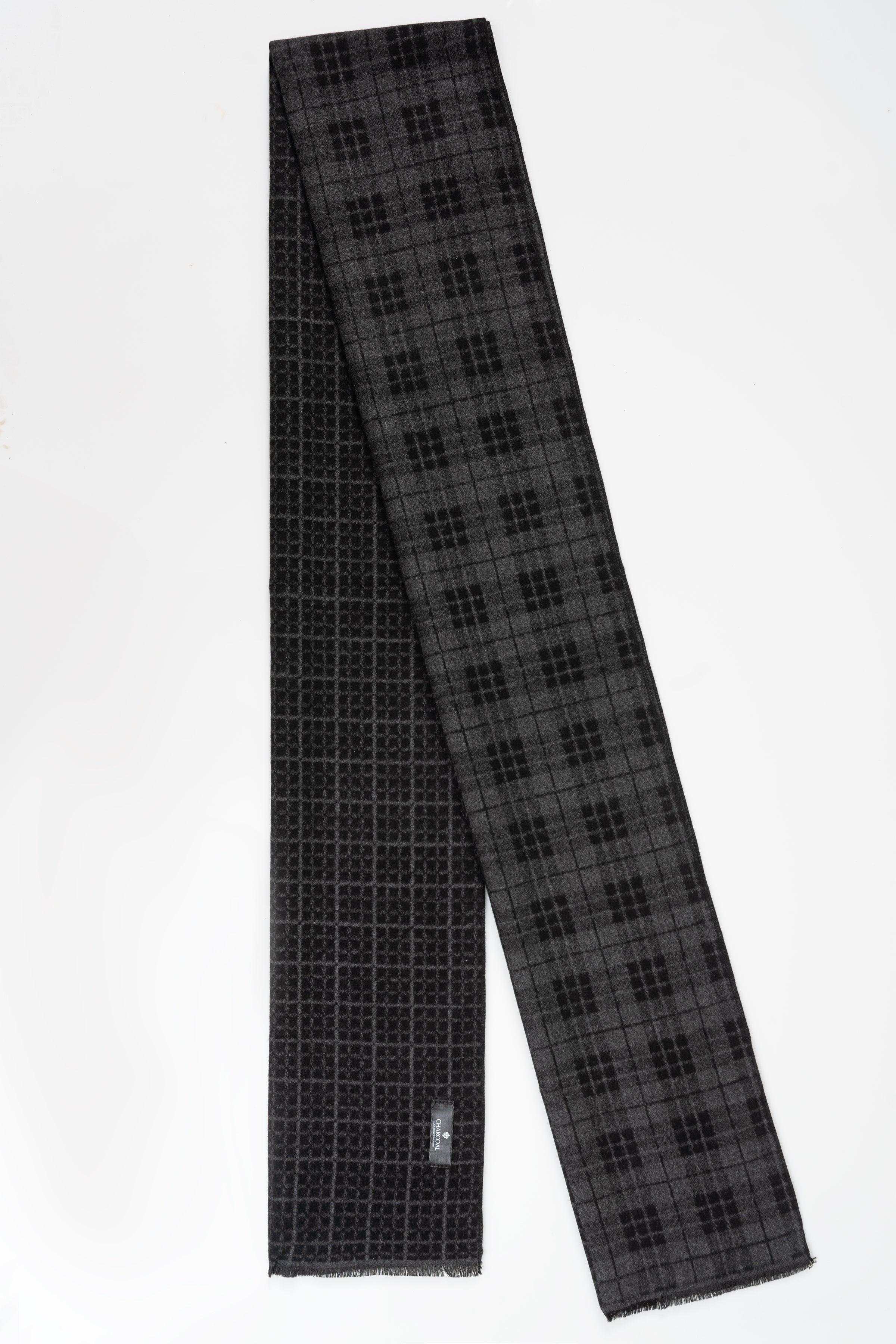 Black check-pattern scarf, long and narrow, with fringed ends.