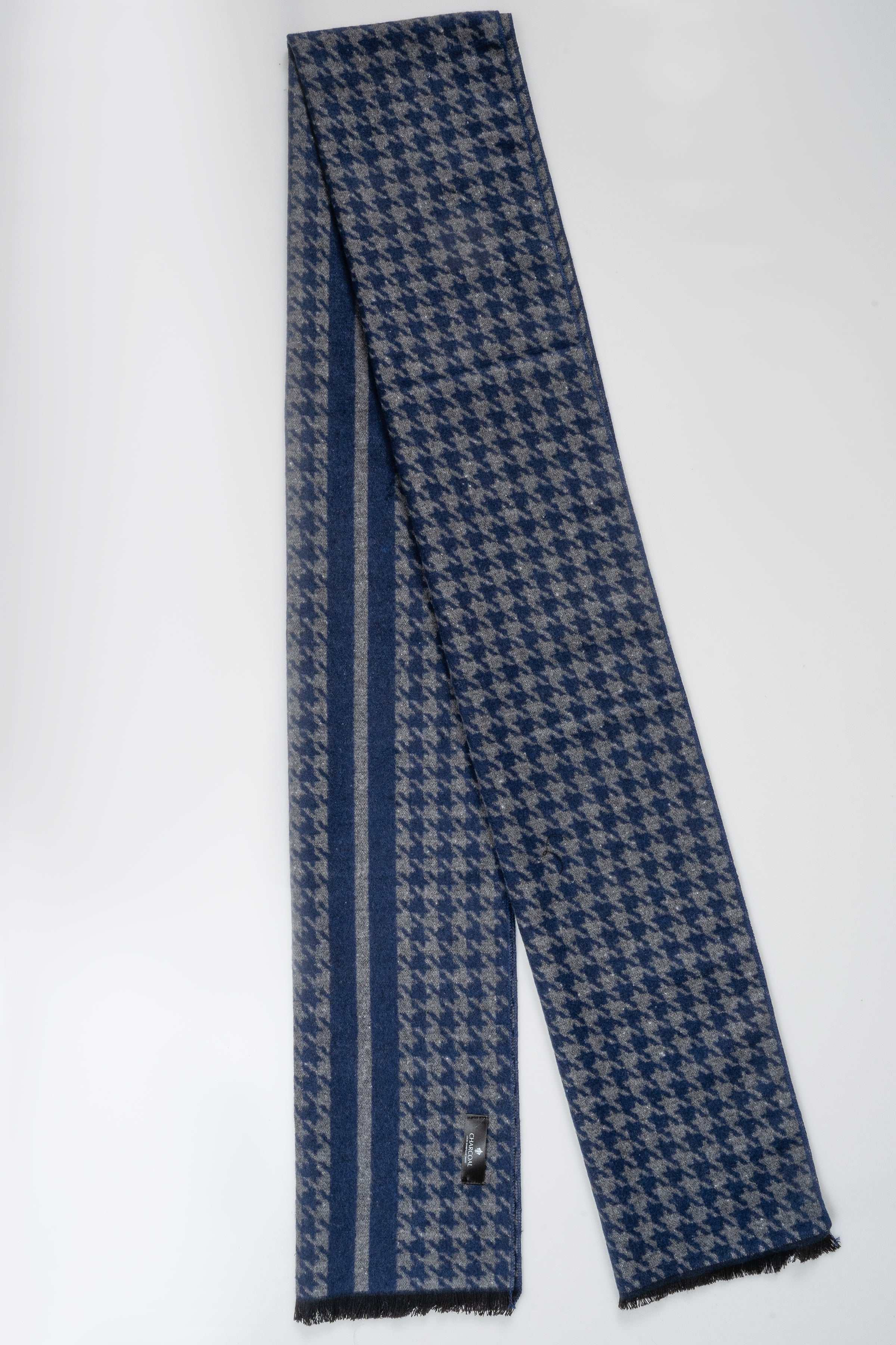 Blue scarf with dark houndstooth pattern and striped border, fringed ends