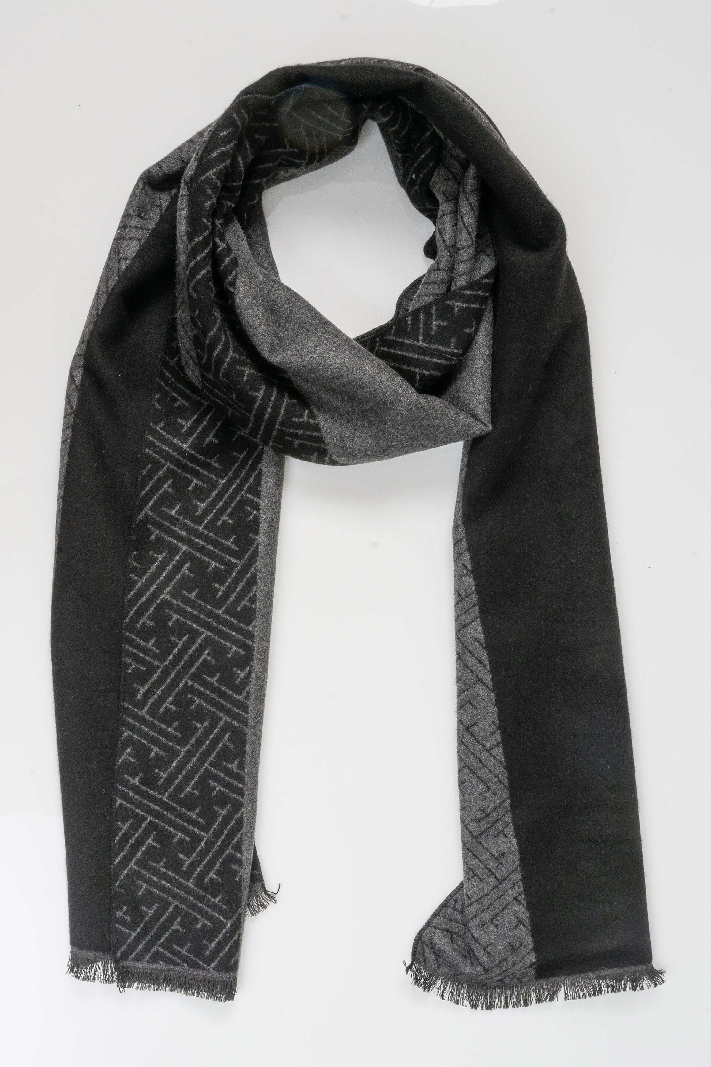 Charcoal and black patterned scarf with fringed ends, draped