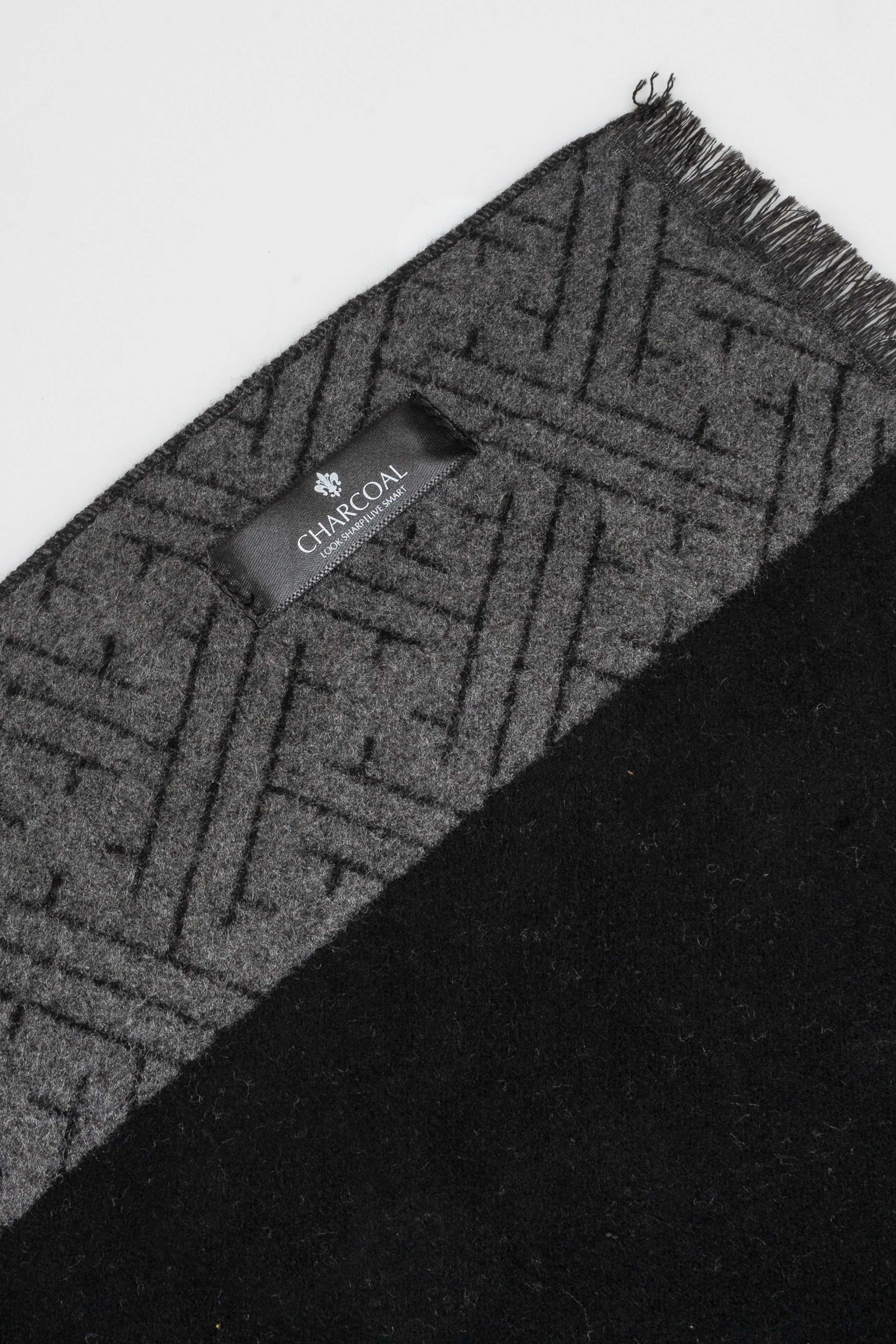 Charcoal geometric scarf detail with fringe ends and small brand tag