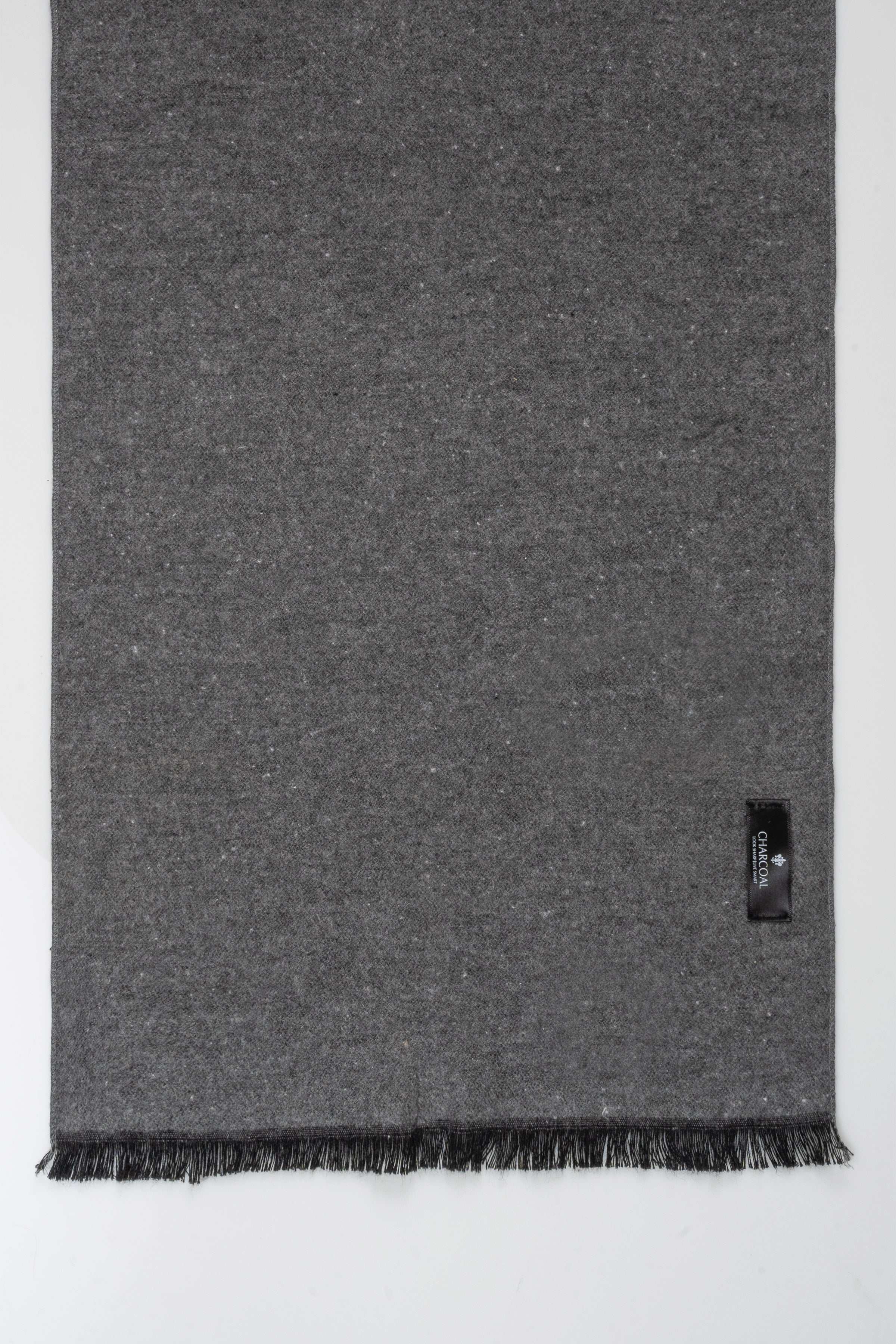 Charcoal gray scarf with fringed hem and small brand tab