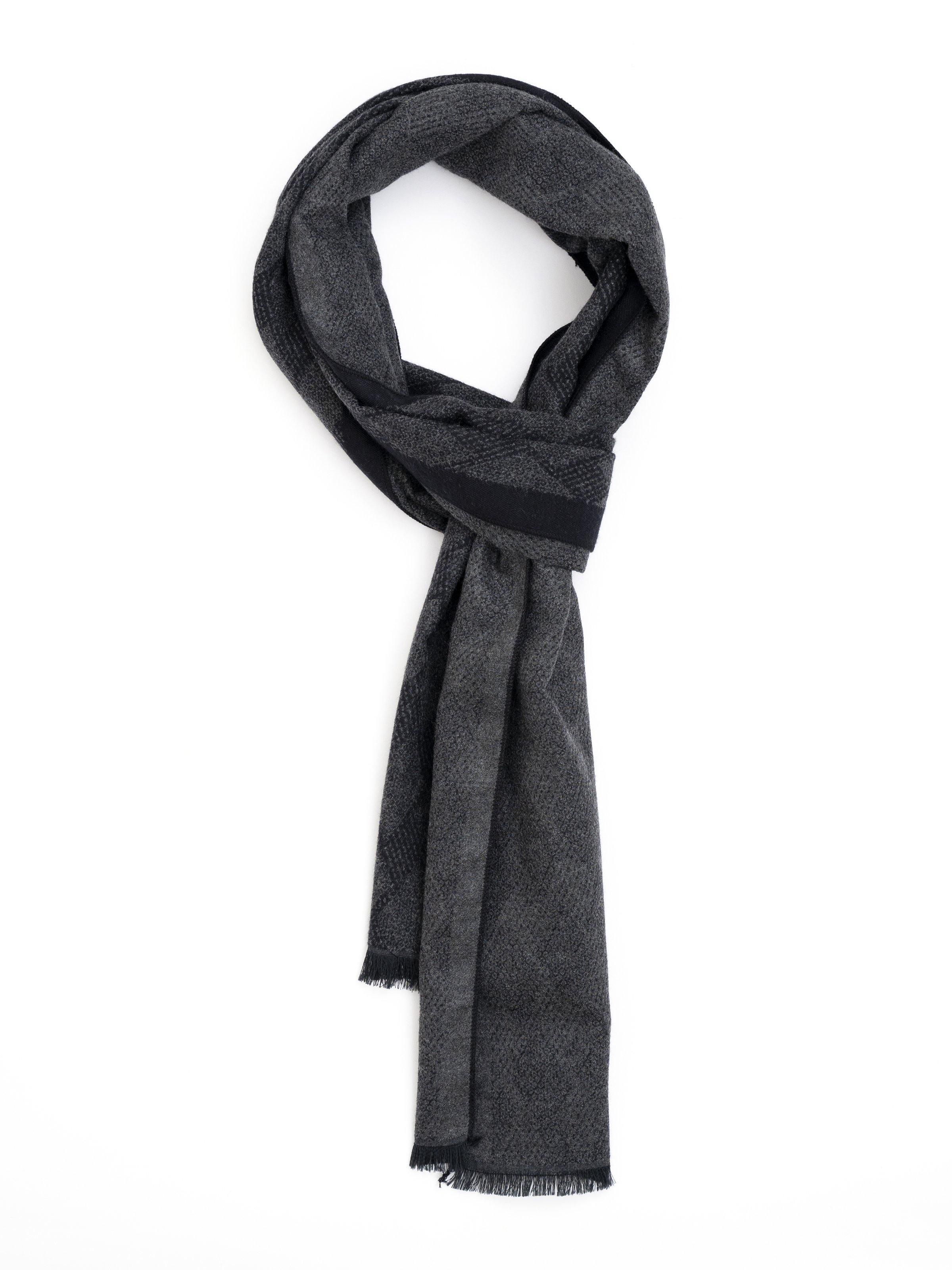 Scarf in dark charcoal gray with woven texture and fringed ends